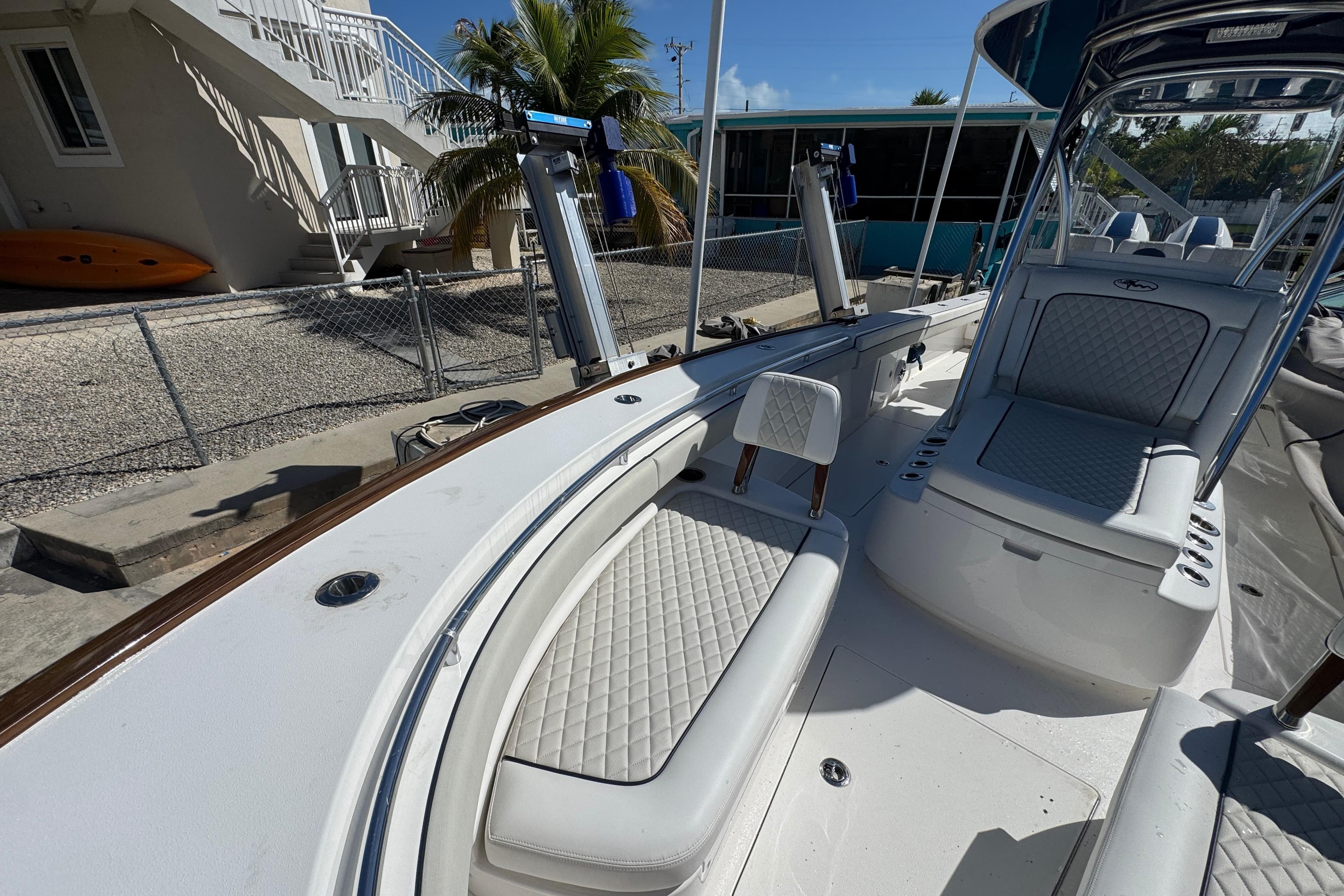 2024 Valhalla V-29 Hybrid boat interior with cushioned seating and sleek design.
