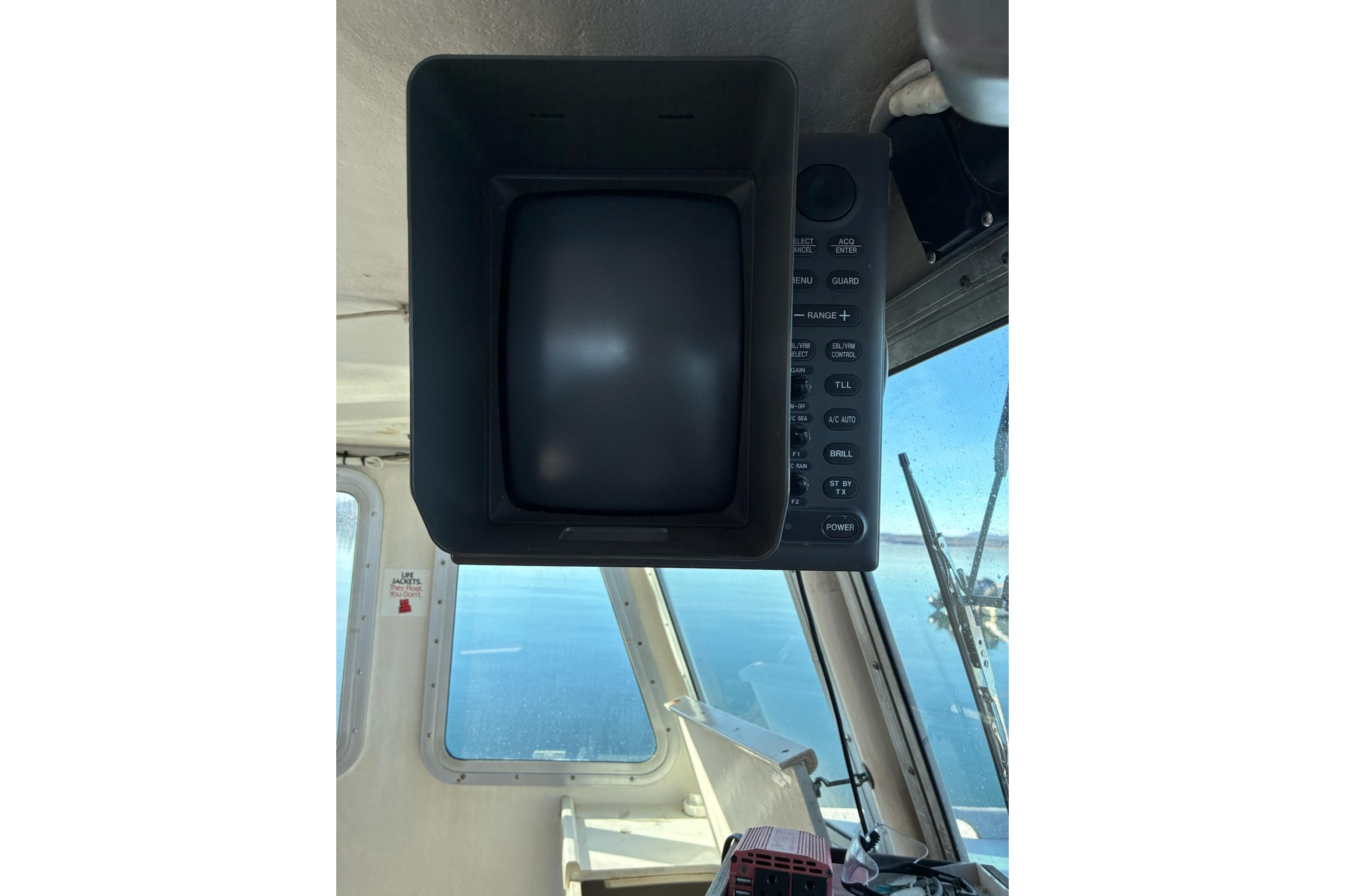Calvin Beal COI Passenger 2000 boat interior with navigation equipment and sea view.