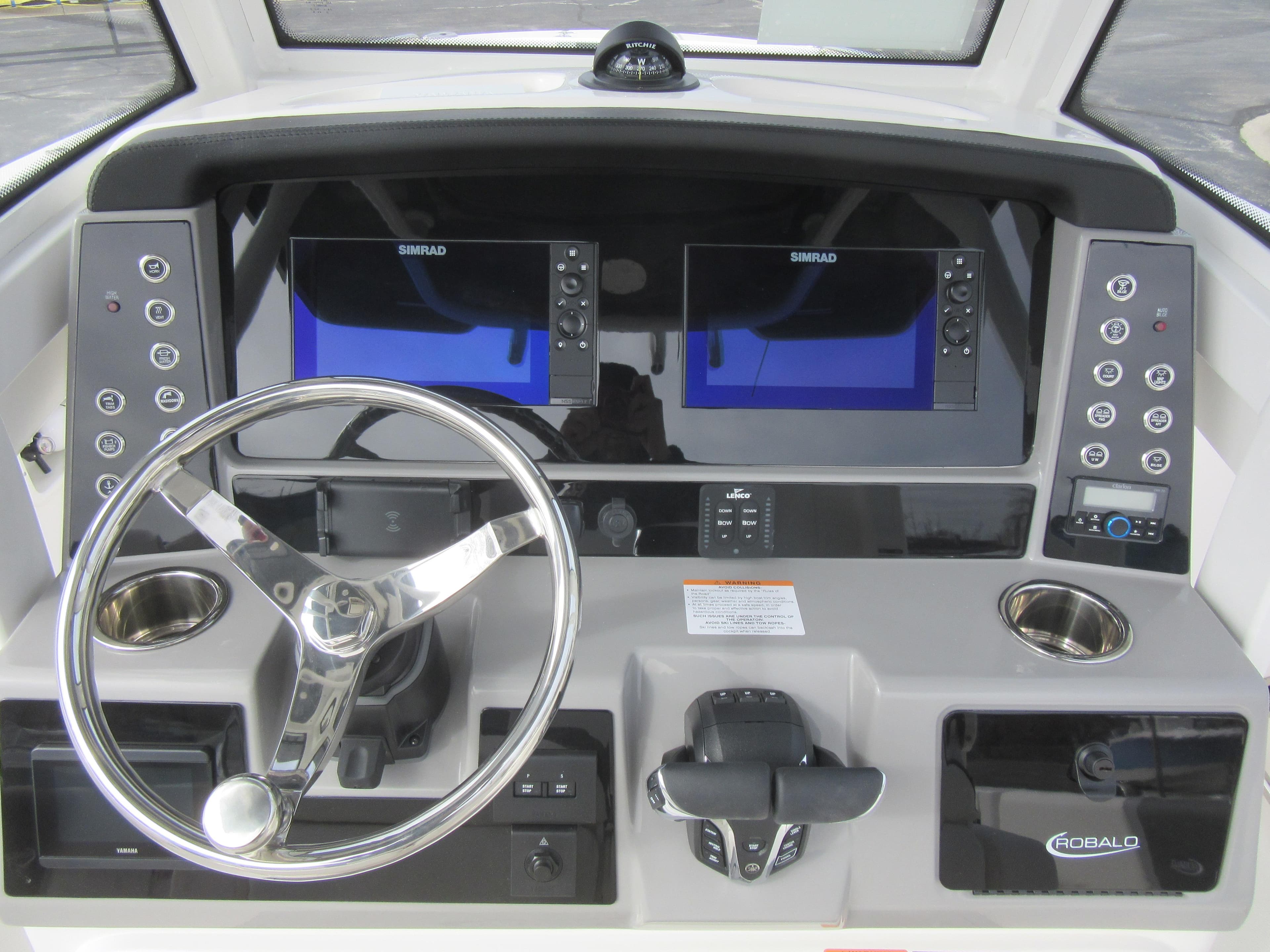 2024 Robalo R250 Center Console boat dashboard with dual Simrad displays.