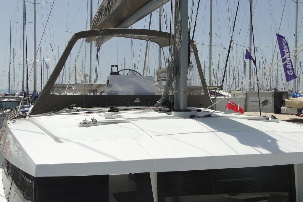 2016 Bali 4.5 catamaran docked at marina with sails and rigging visible.