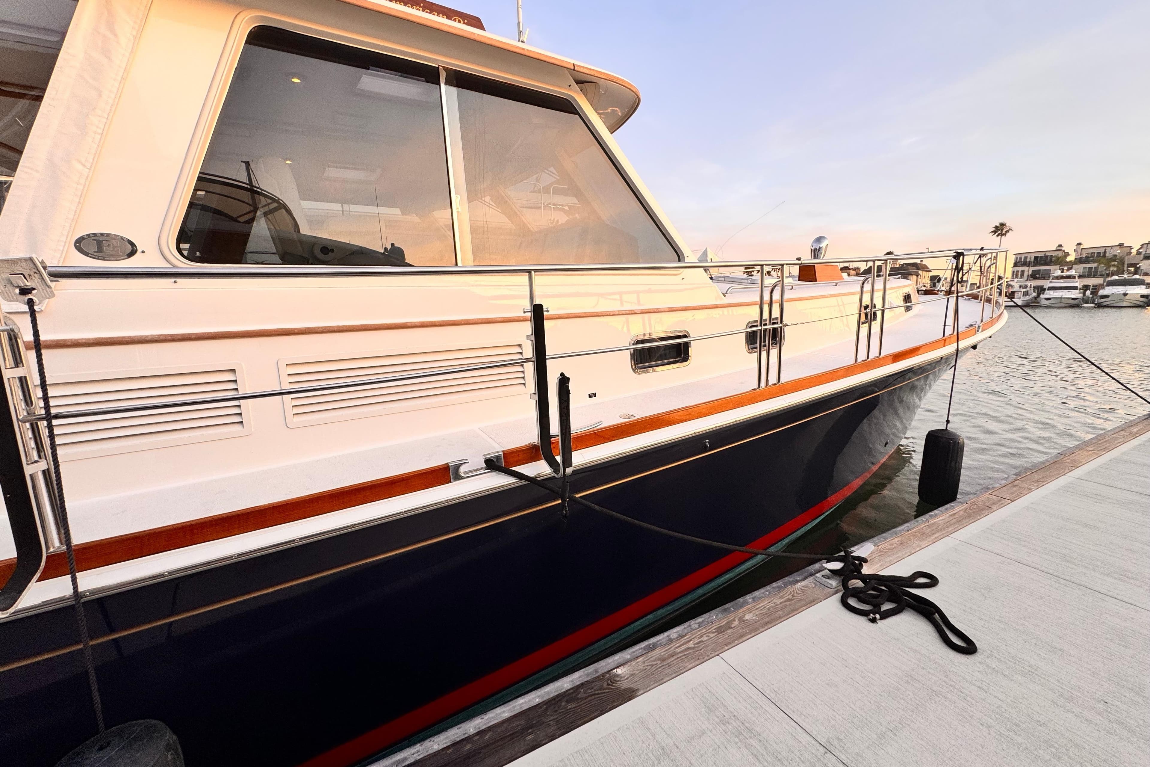 2000 Grand Banks East Bay 49 yacht docked at marina.
