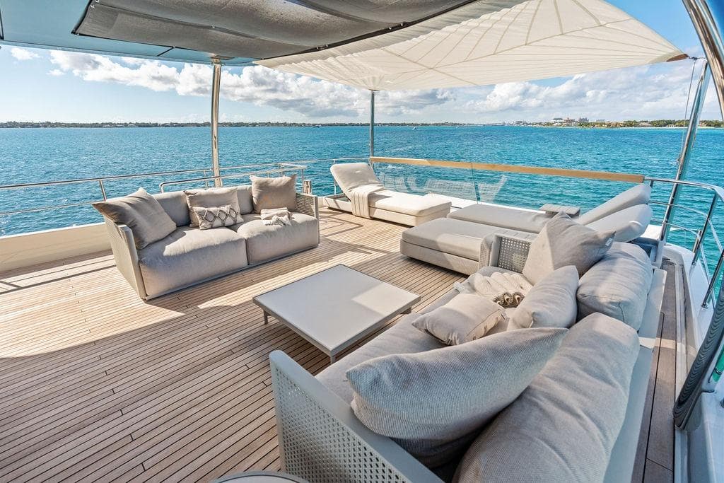 Luxurious 2023 Sanlorenzo SD118 yacht deck with elegant seating and ocean view.