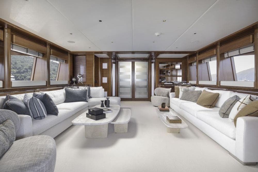 Luxurious interior of 2009 CRN 129 yacht with elegant sofas and modern decor.