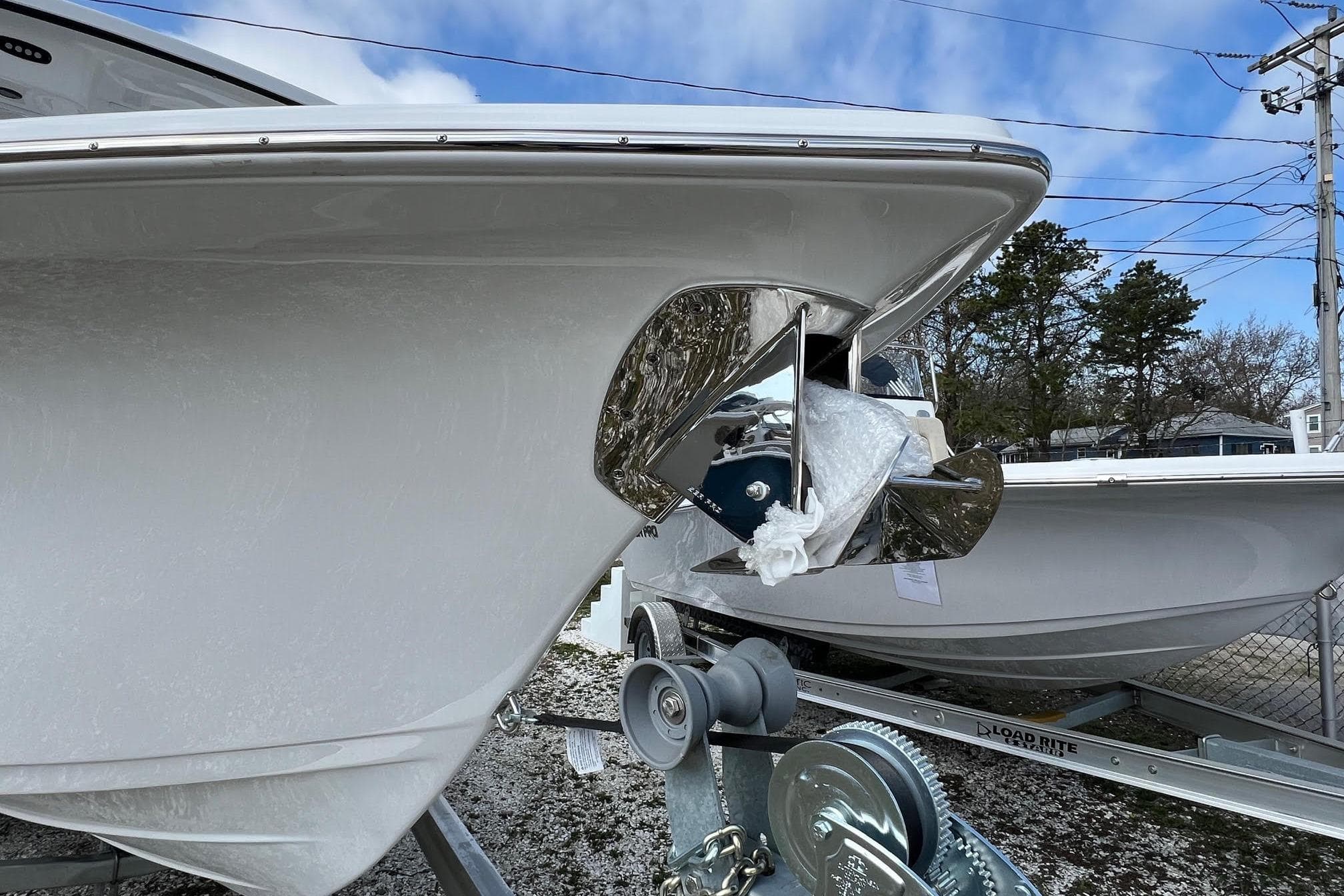 2026 Sea Pro 240 Dual Console boat on trailer, showcasing bow and anchor detail.