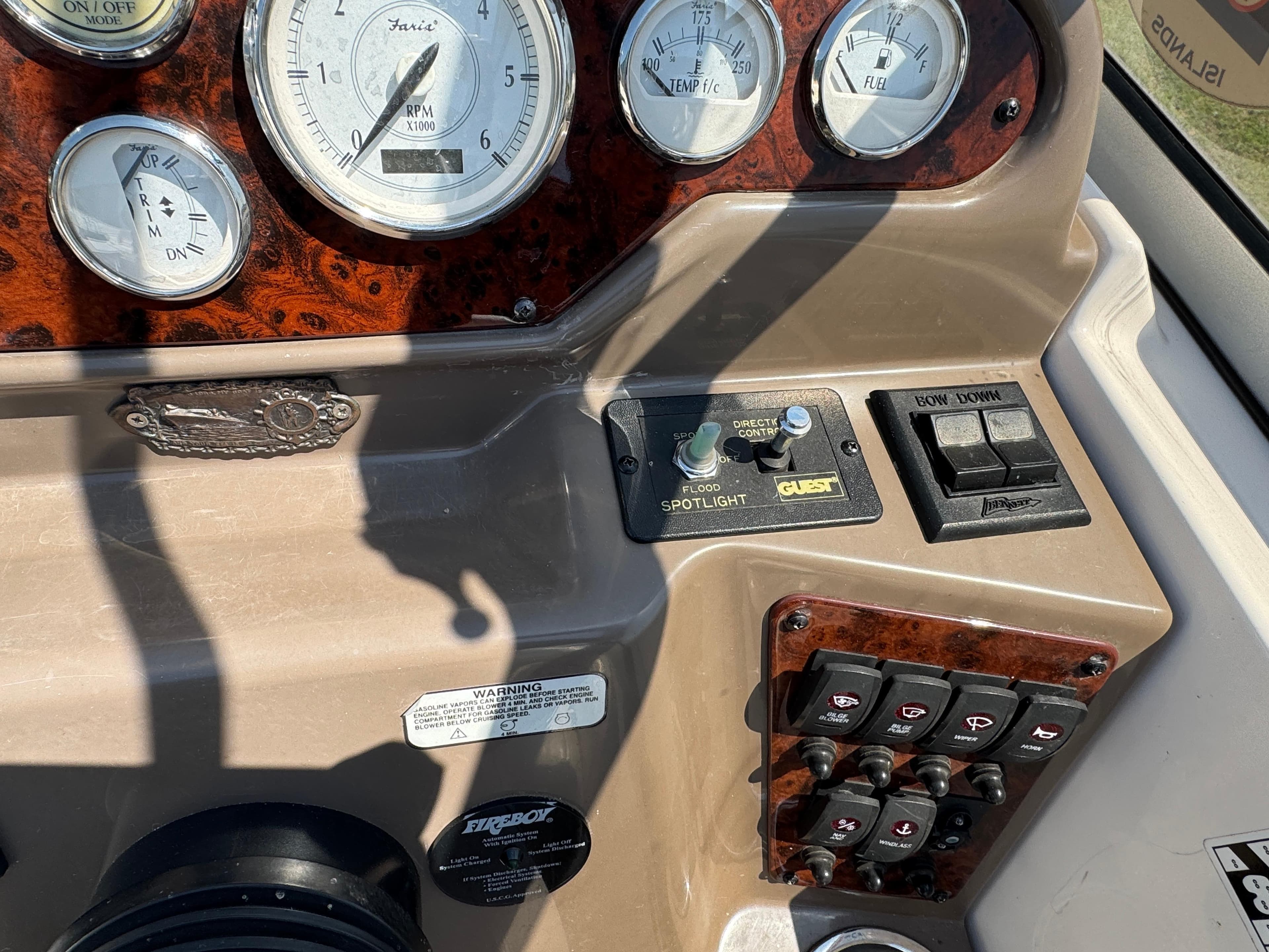 Control panel of a 2006 Regal 2565 Window Express boat with gauges and switches.