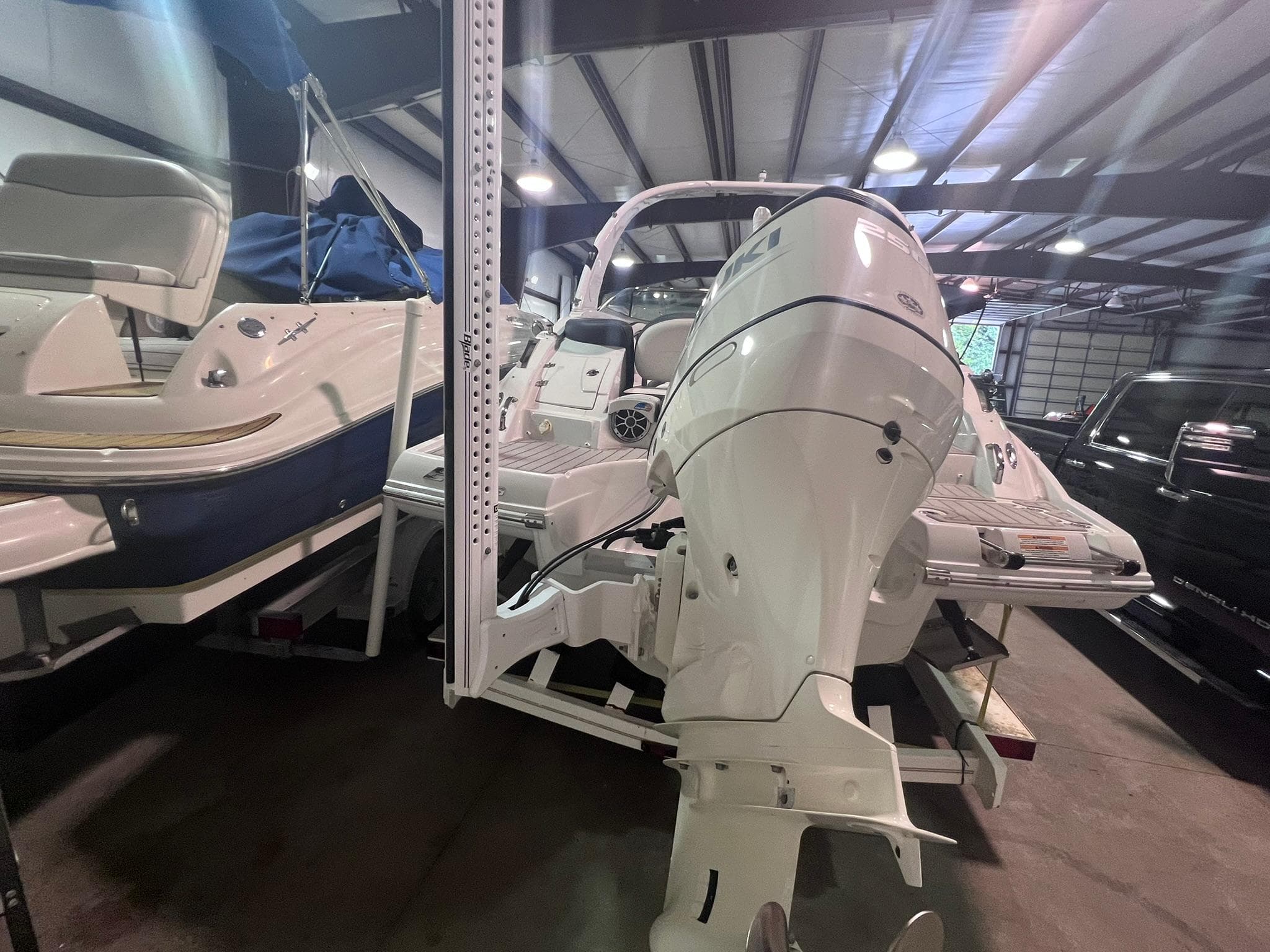 2020 Crownline Eclipse E225 XS boat in storage, featuring a powerful outboard motor.