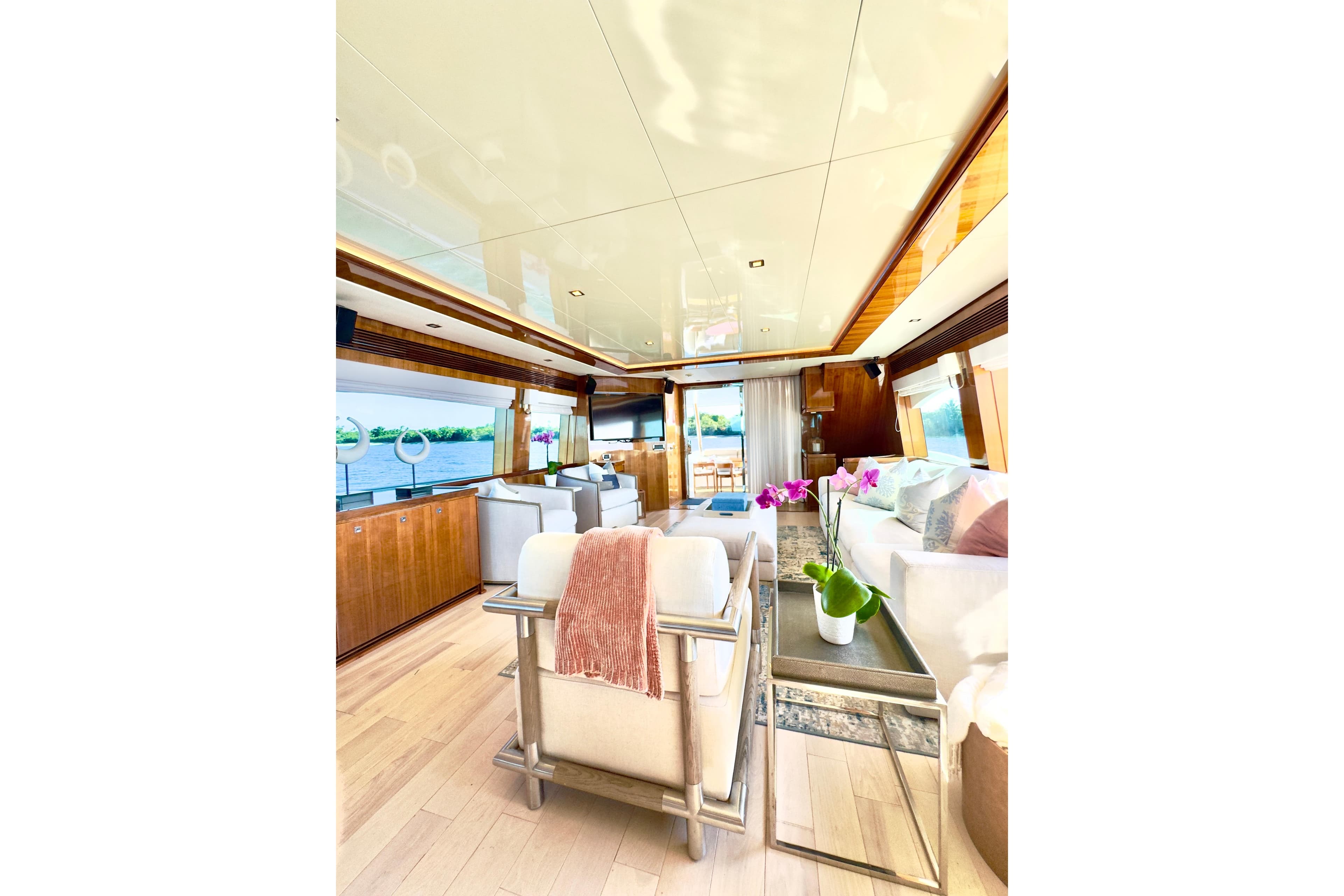 Luxurious interior of 2011 Horizon E88 yacht with elegant furnishings and scenic water views.