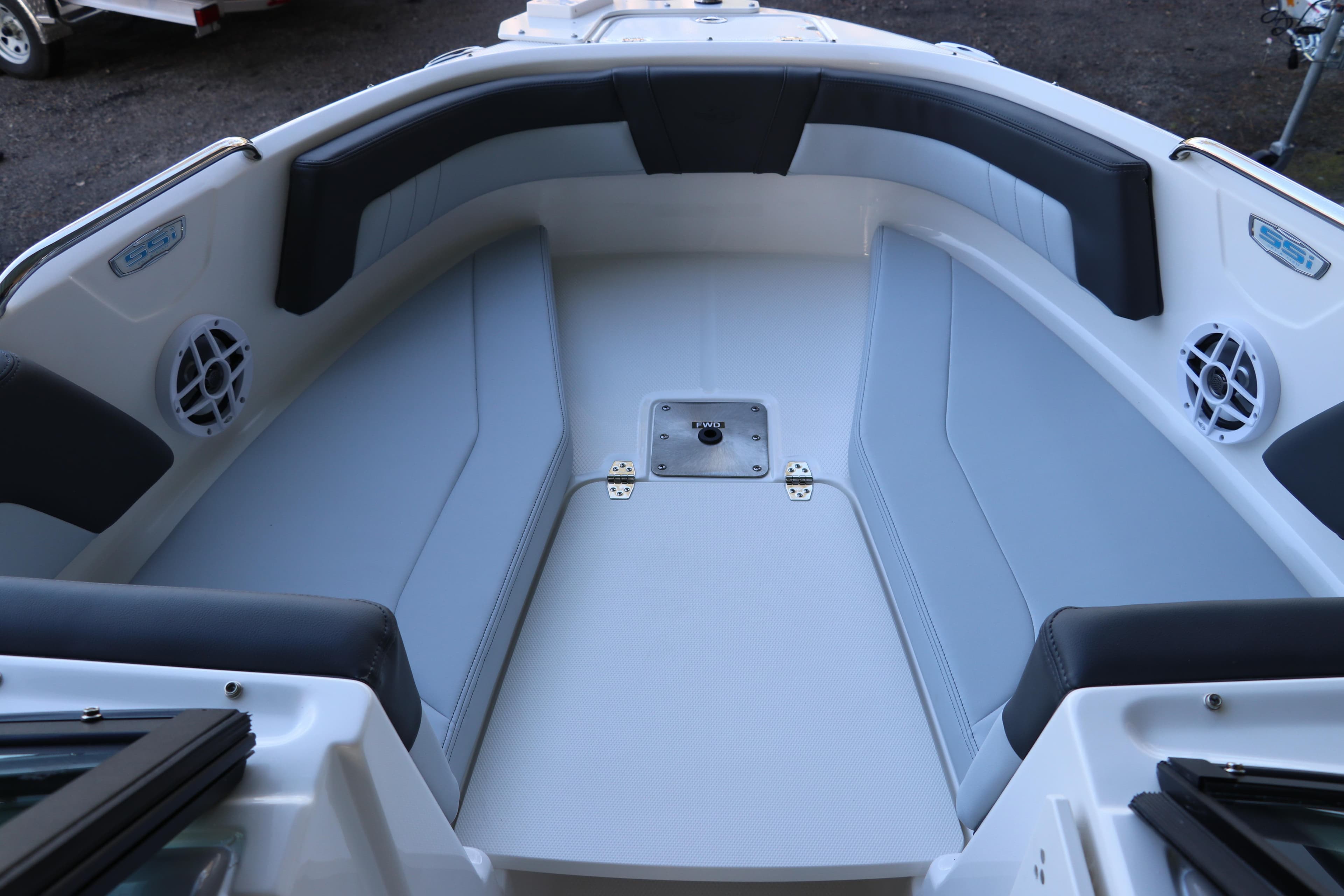 2026 Chaparral 21 SSi Ski & Fish OB boat interior with cushioned seating and speakers.