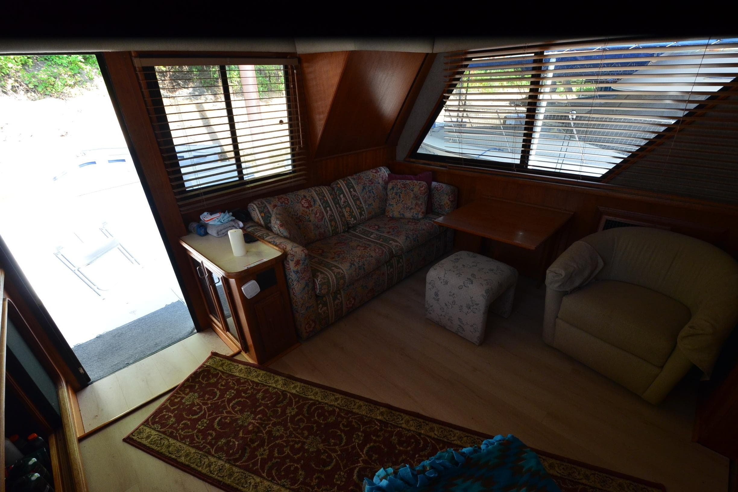 Interior of 1986 Carver Cockpit 4227 MY with cozy seating and large windows.