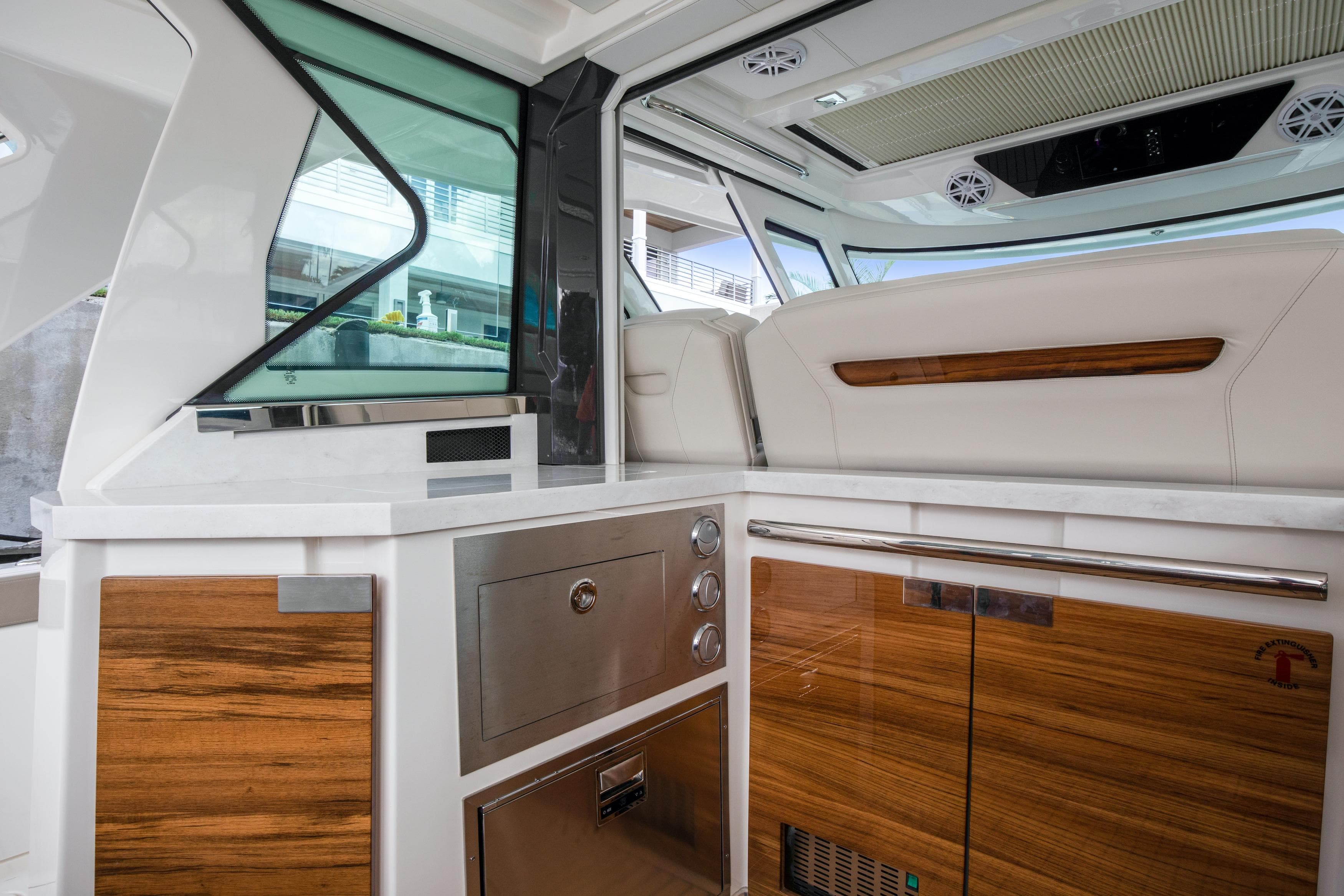 Interior of 2022 Tiara Yachts 48 LS, featuring sleek wood and stainless steel finishes.