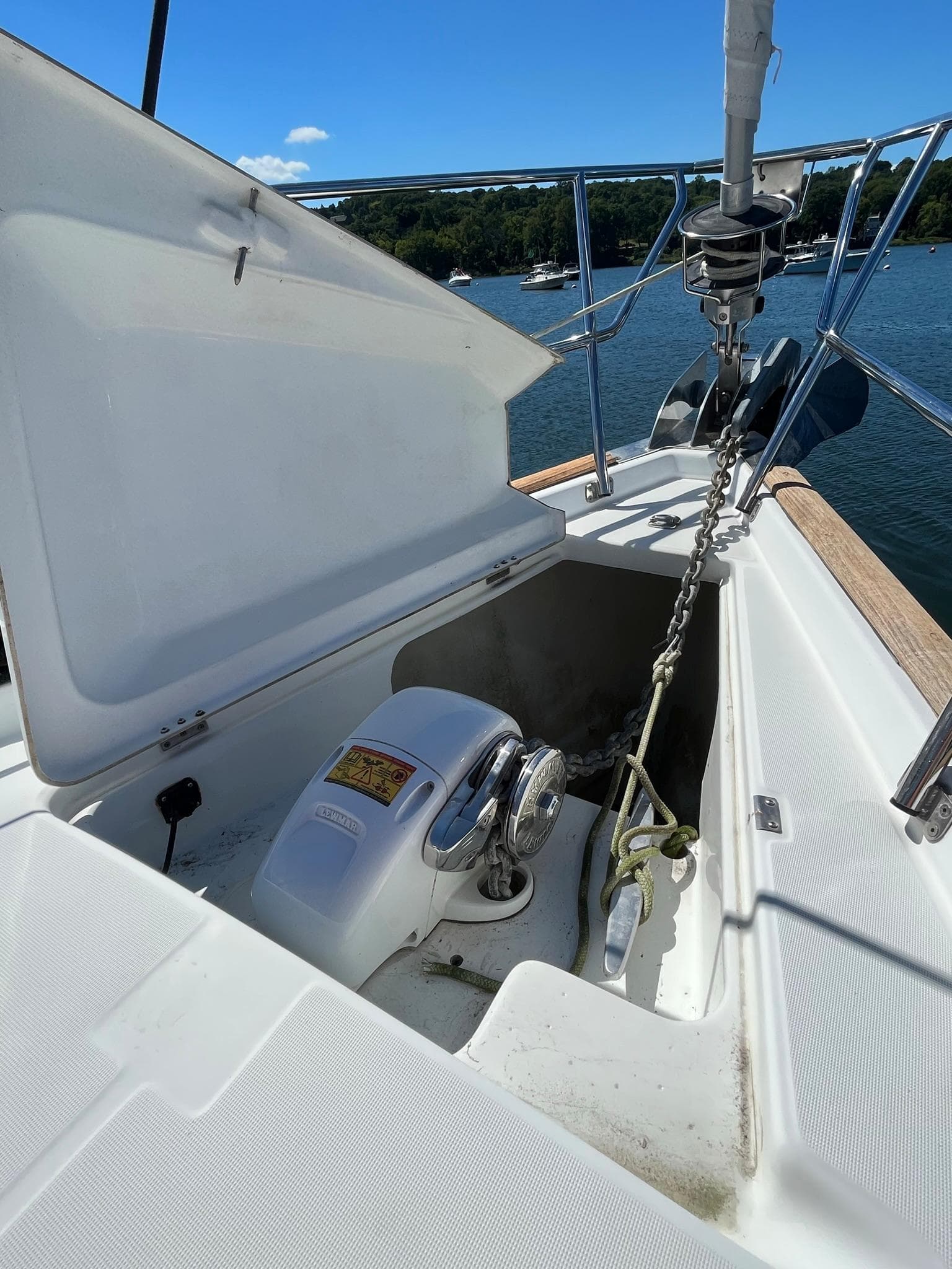 Beneteau 423 sailboat anchor locker, 2004 model, on calm water.