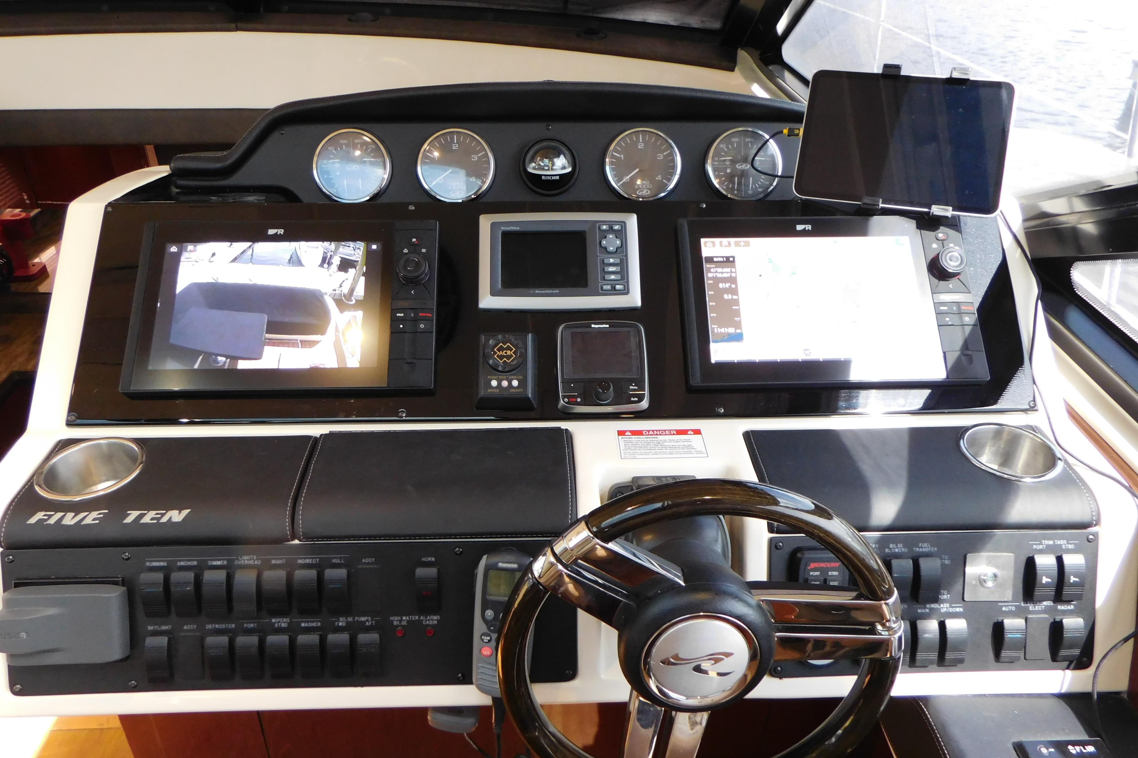 Helm of 2013 Sea Ray 510 Sundancer with advanced navigation displays and controls.