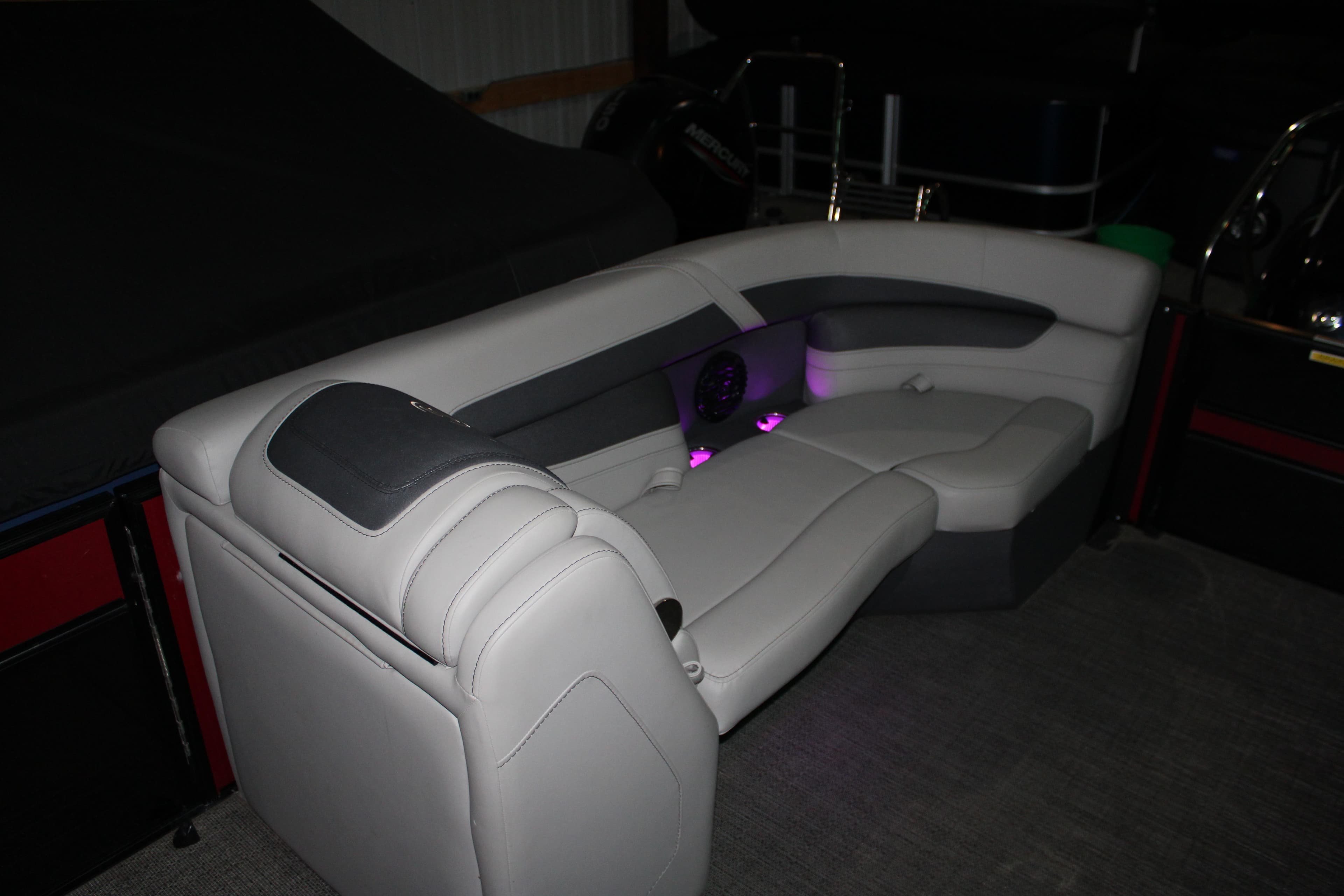 2024 Barletta Cabrio 24UE boat interior with plush seating and ambient lighting.