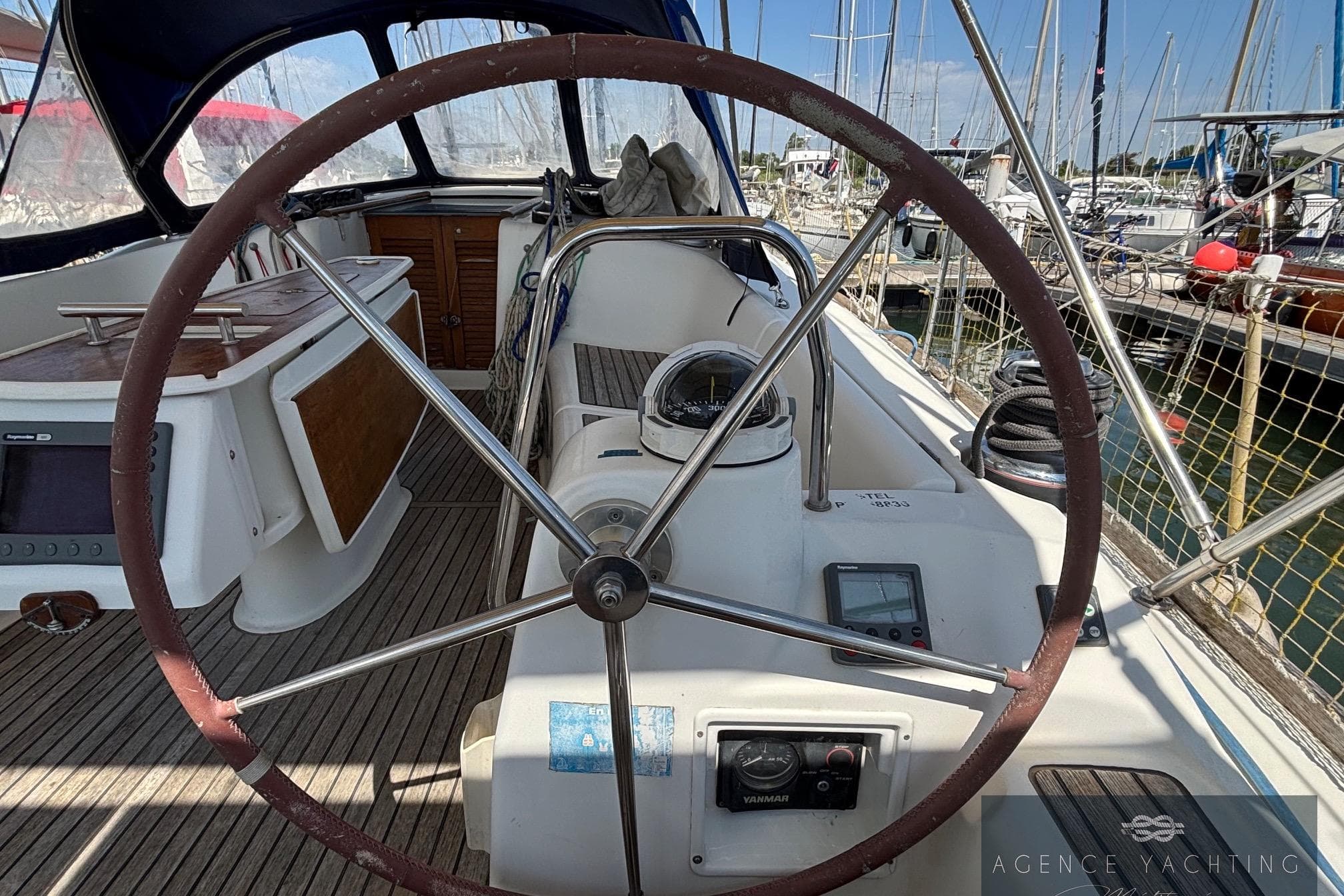 Cockpit of 2008 Beneteau Oceanis 40 sailboat with steering wheel and navigation instruments.
