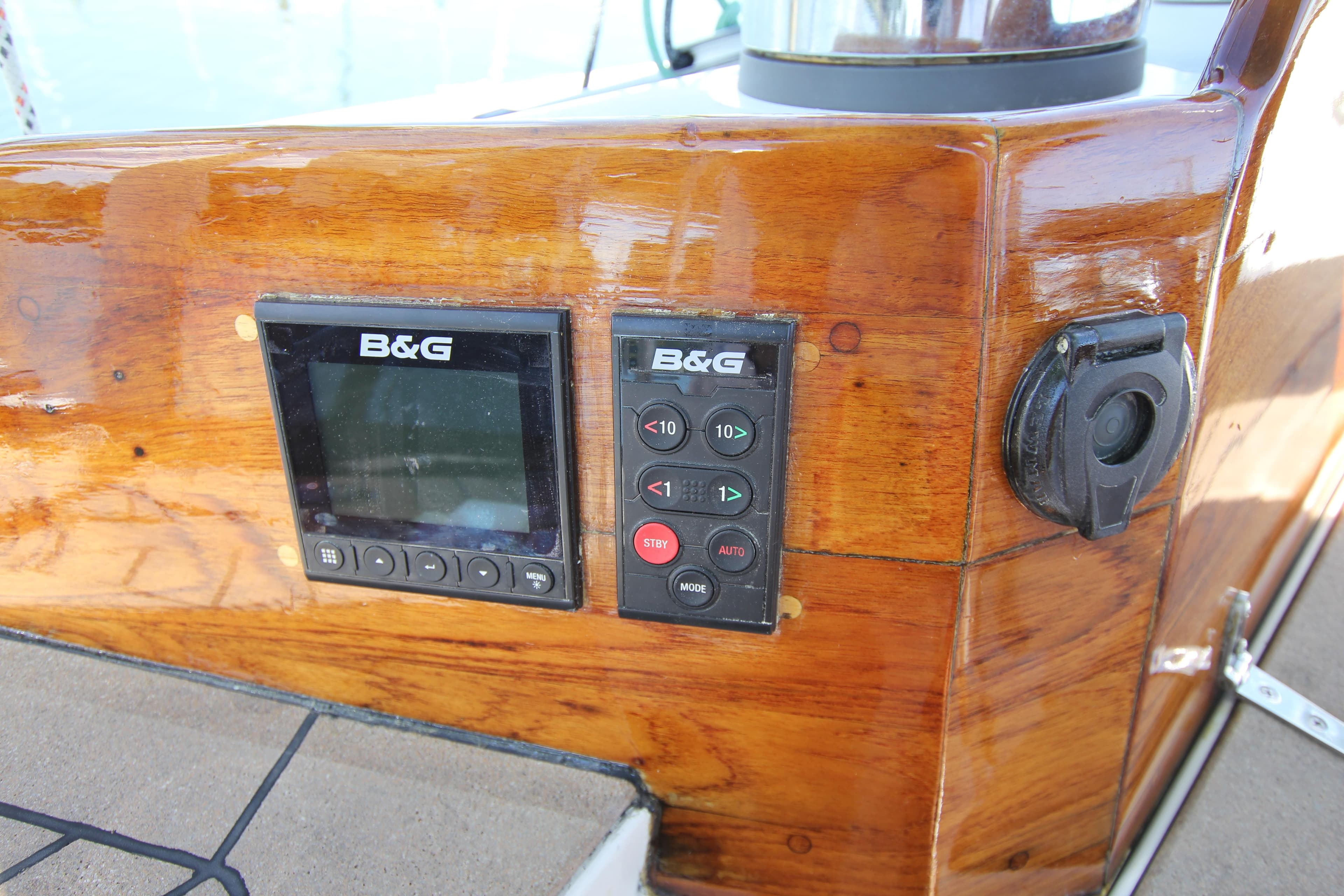 B&G navigation equipment on 1998 Able Apogee 50 yacht's polished wooden dashboard.