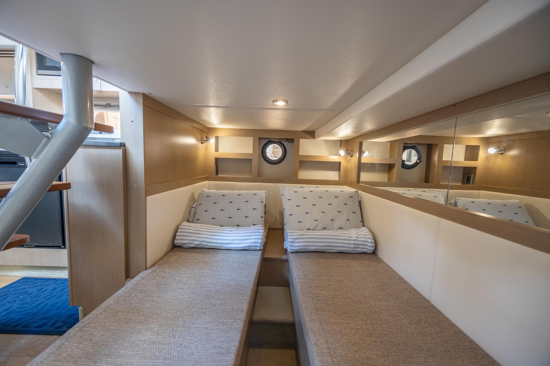 Interior cabin of 2019 Sea Ray Sundancer 350 Coupe with twin beds and modern design.
