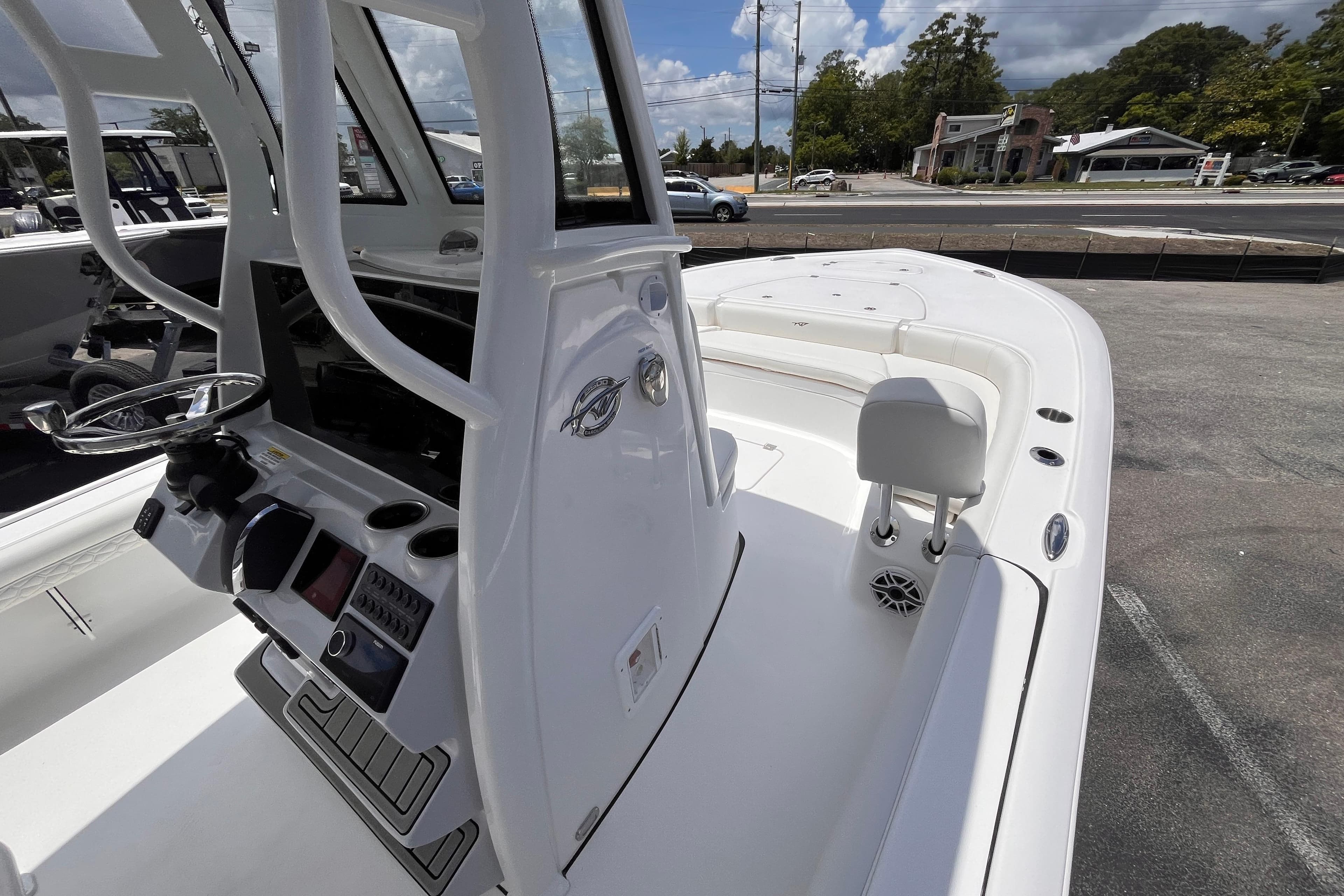 2026 Tidewater 2500 Carolina Bay boat interior with steering console and seating.