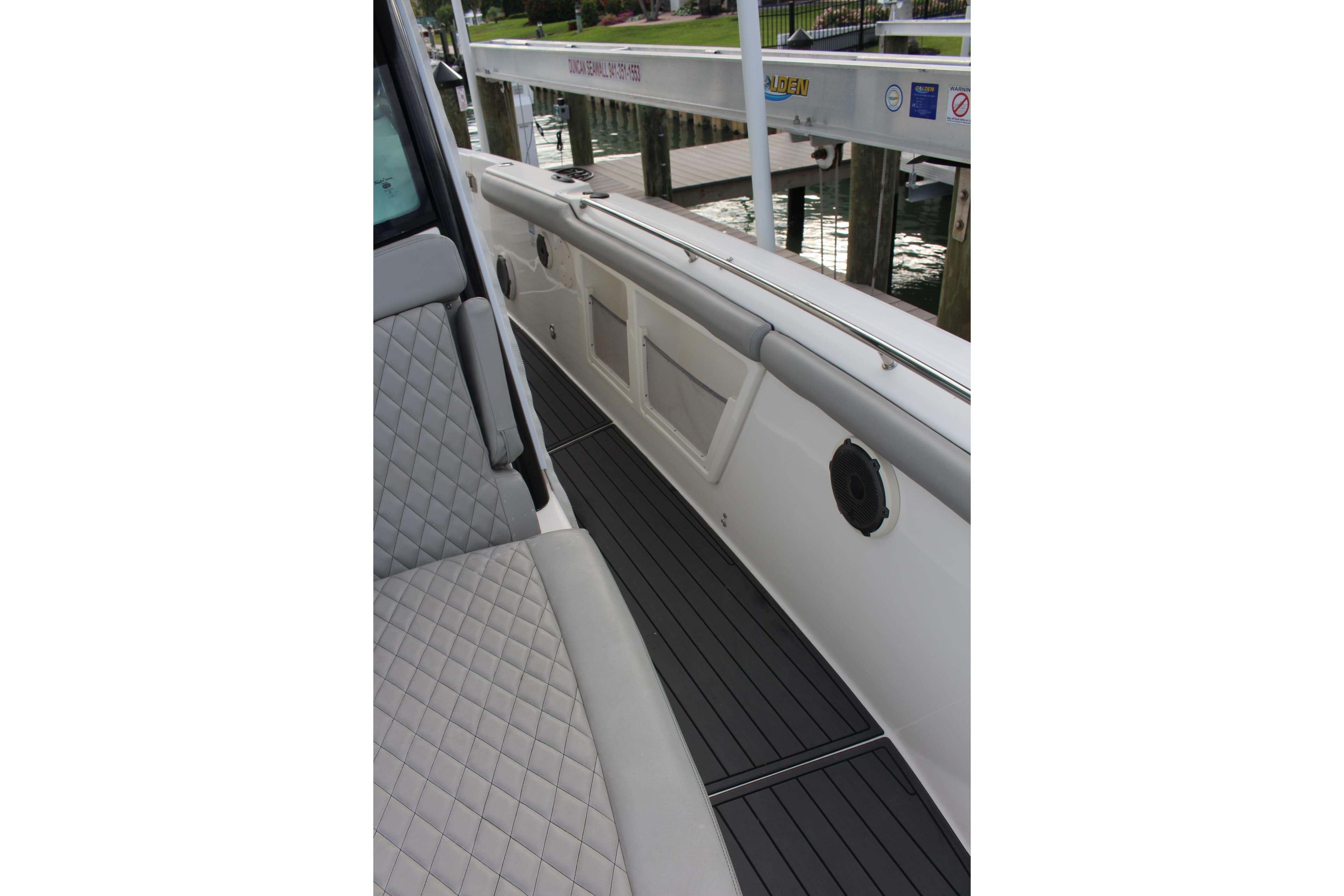2020 Boston Whaler 350 Outrage interior with quilted seating and sleek deck design.