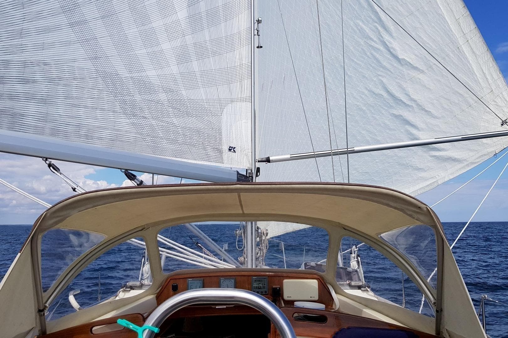 Sailing view from Regina af Vindö 43 DS, 1999 model, on open sea.