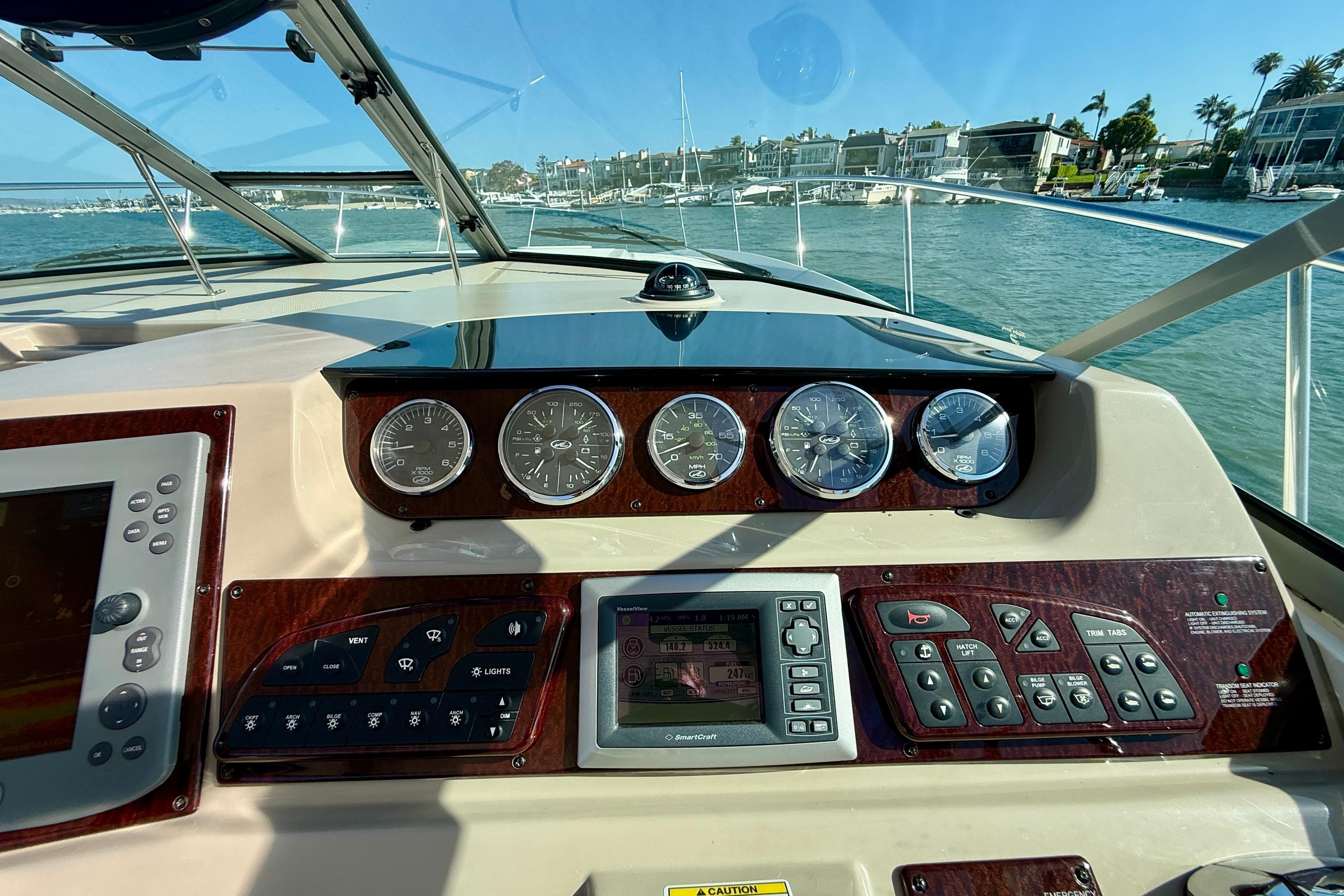 Cockpit view of 2009 Sea Ray Sundancer 350 with navigation instruments and gauges.