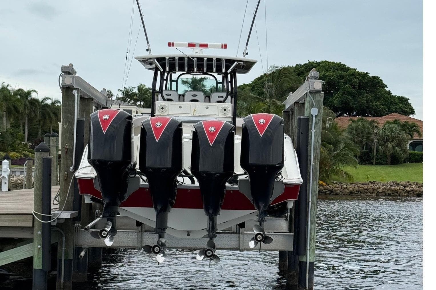 2013 Hydra-Sports 42 boat with four powerful outboard engines docked by the water.