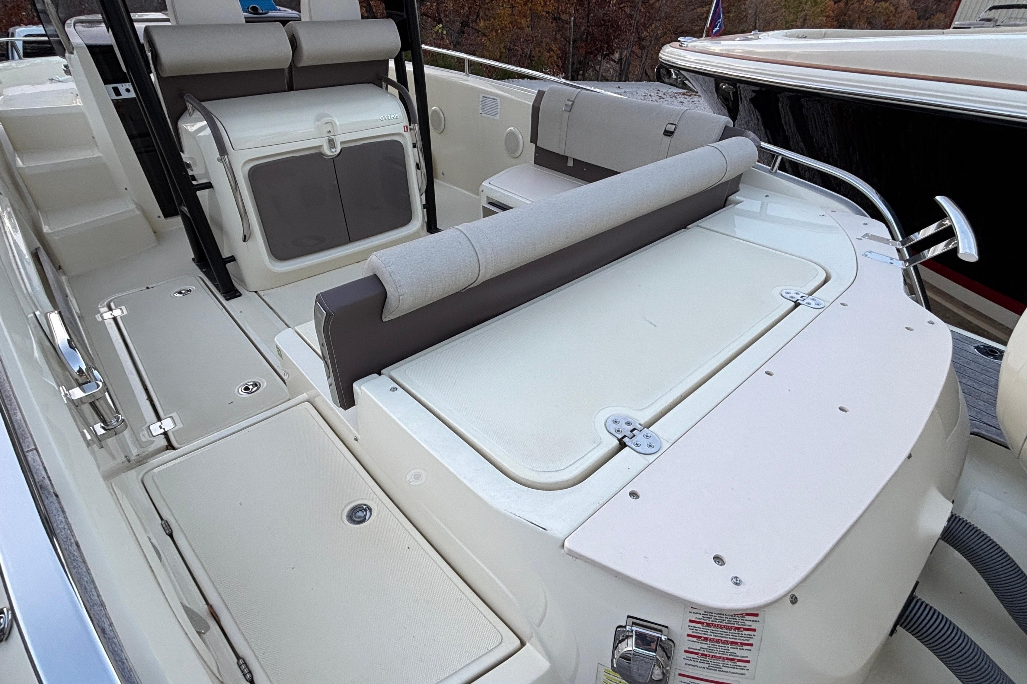 2024 Invictus GT280S boat interior with seating and storage compartments.