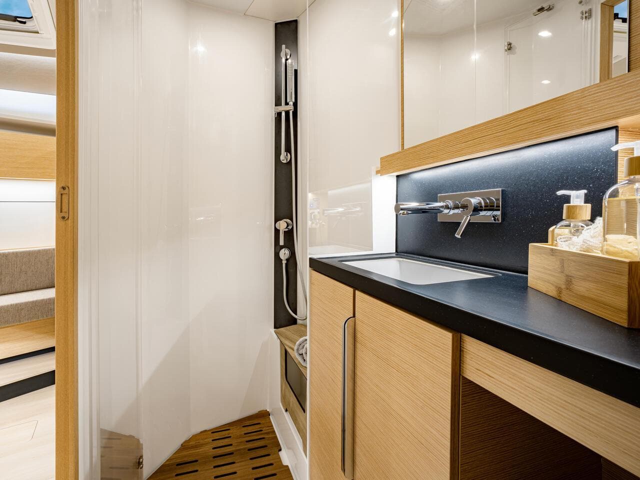 Luxurious bathroom interior of 2025 Hanse 510 yacht with modern fixtures.