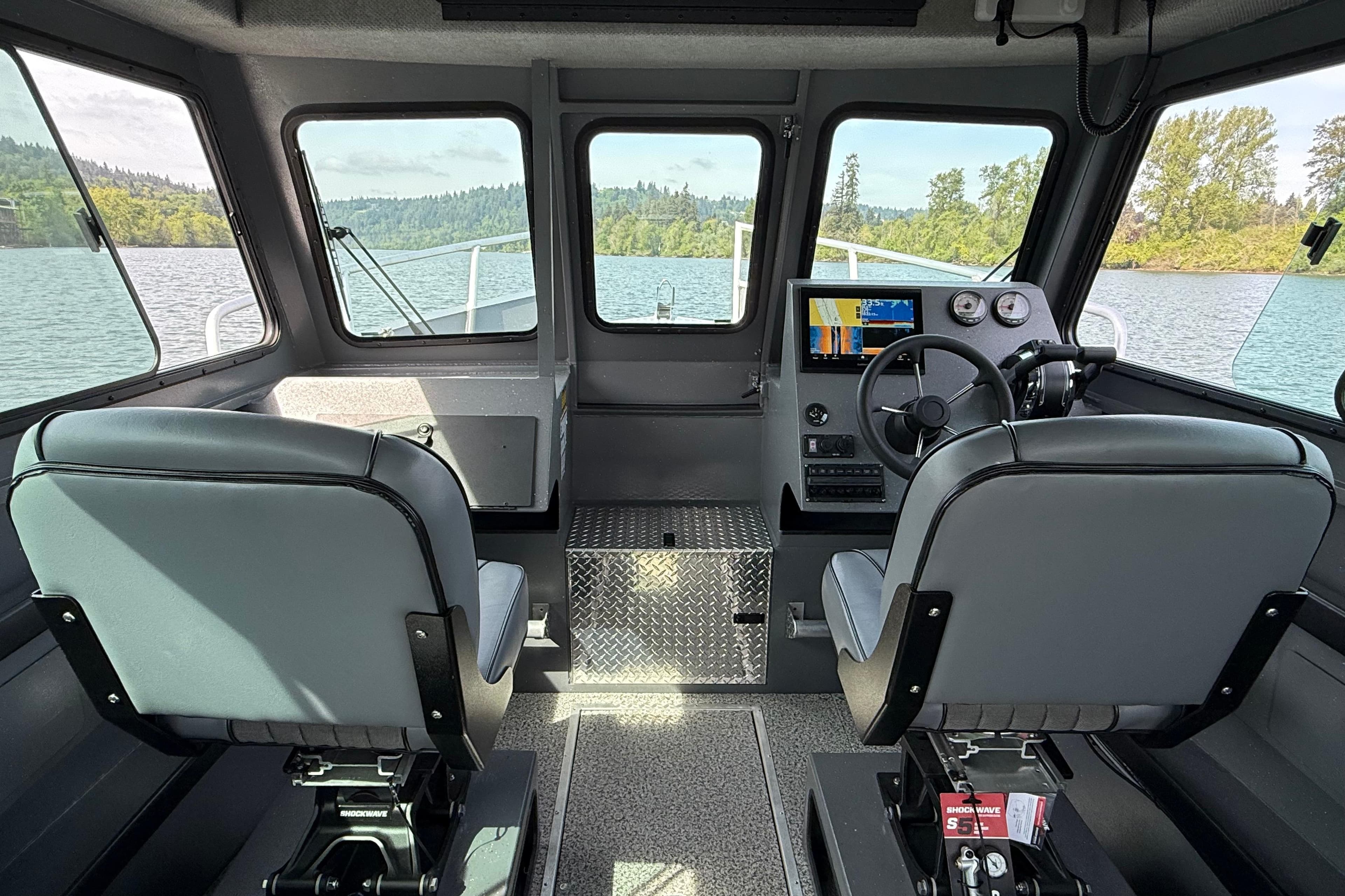 Interior of 2026 Alumaweld Horizon 26 boat with modern dashboard and seating.