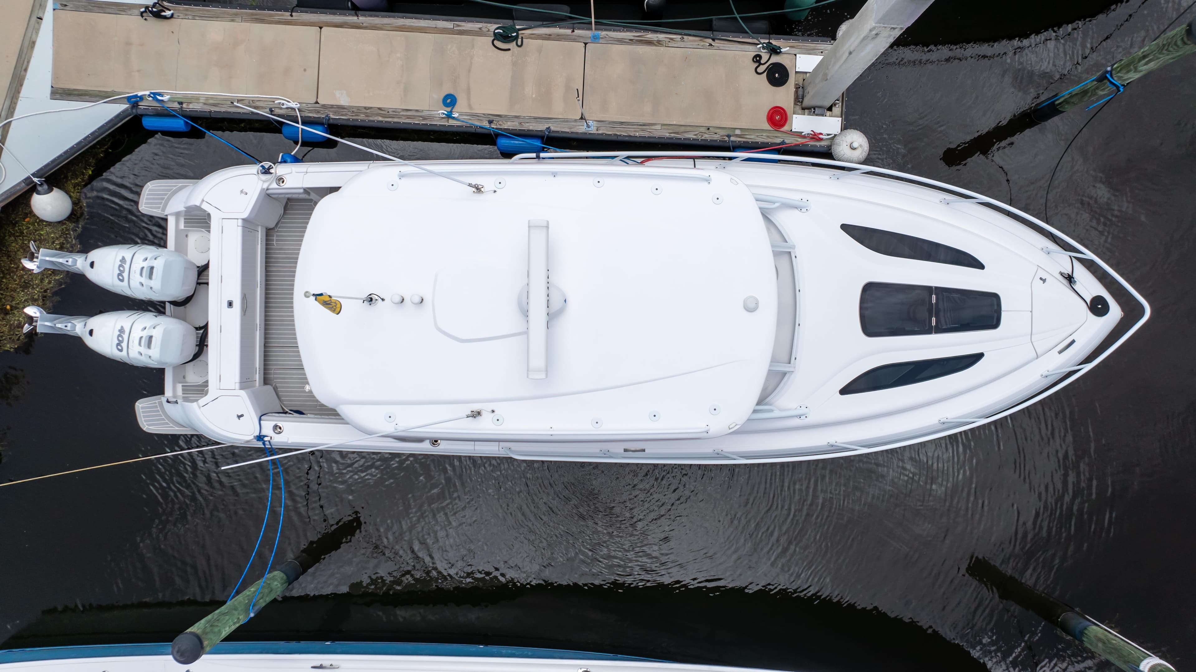 Top view of a 2022 Intrepid 345 Valor yacht docked at a marina.