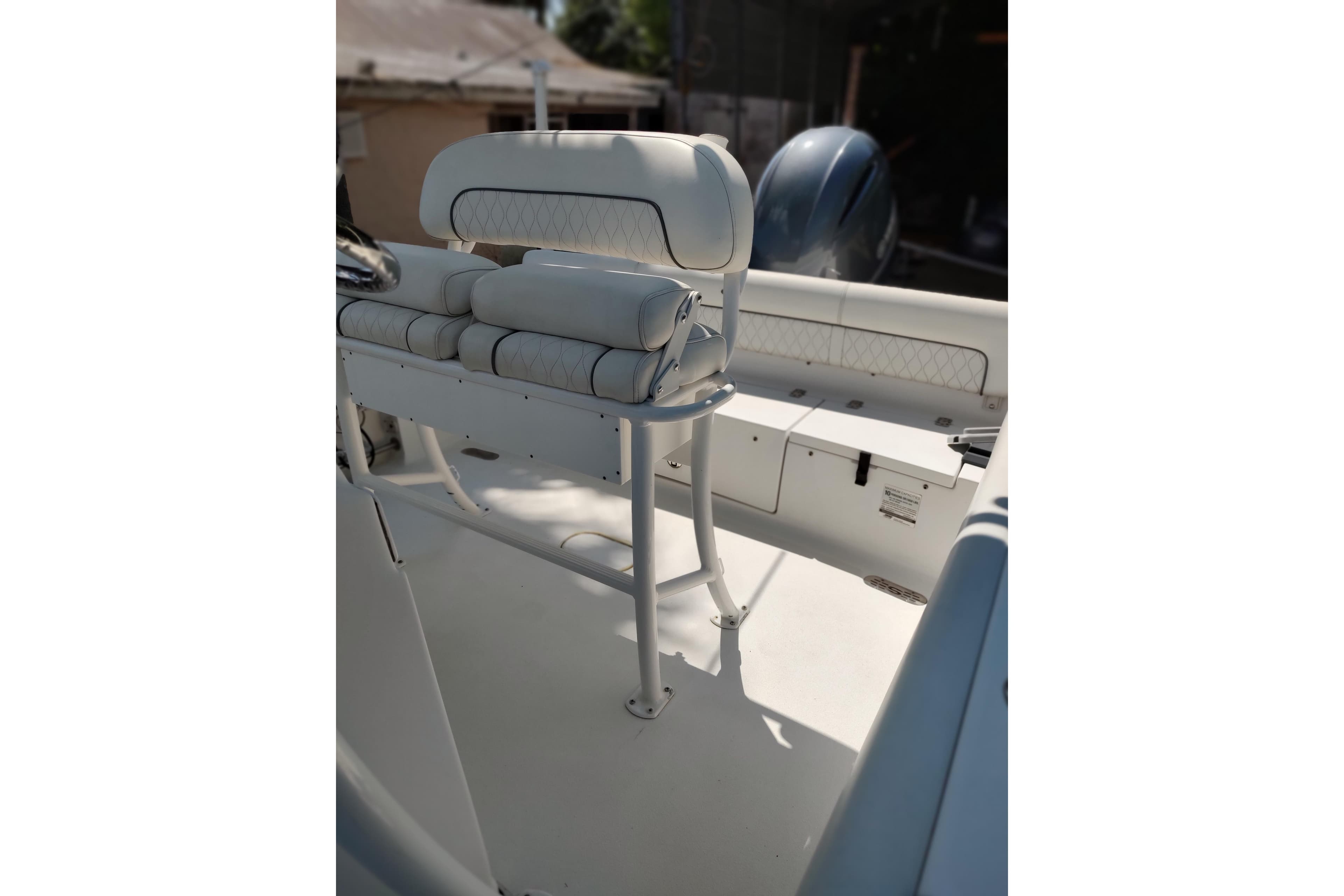 2020 Sportsman Heritage 211 Center Console boat interior with cushioned seating.