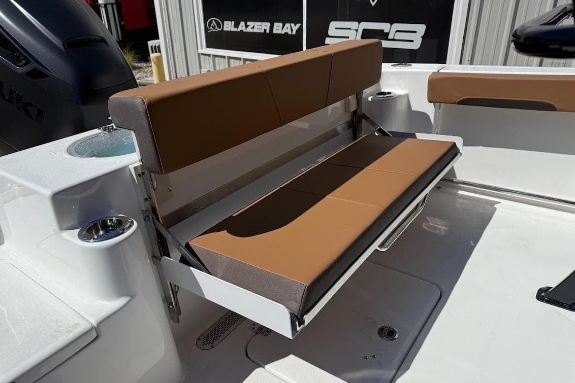 2026 Sea Pro 242 Center Console boat with foldable brown seating.