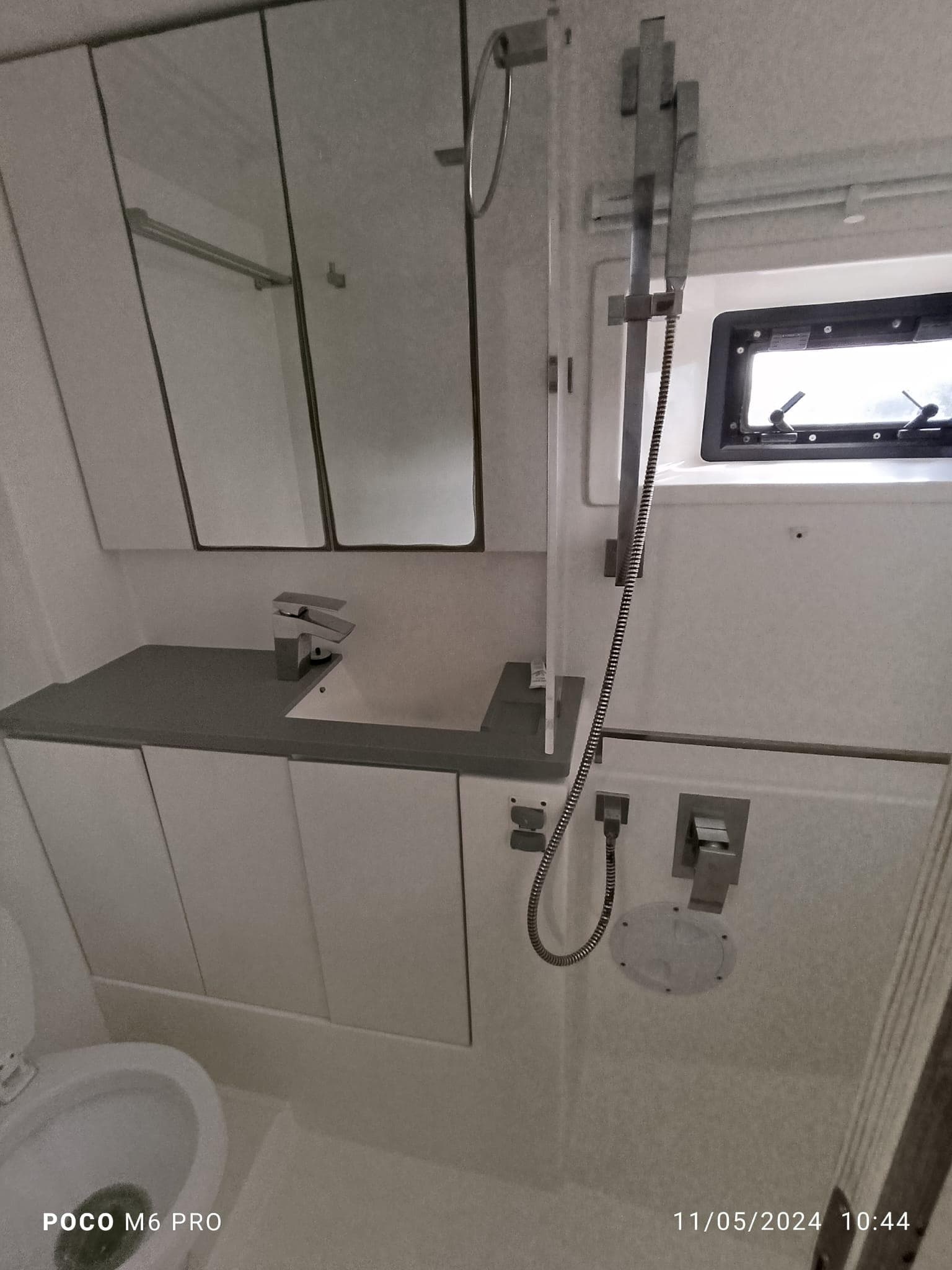 Modern bathroom in a 2020 Leopard 45 yacht with sleek fixtures and a compact design.