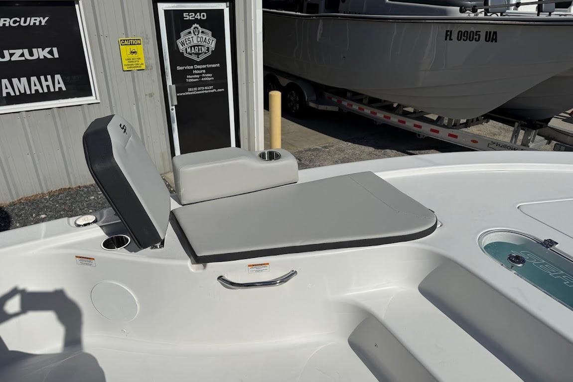 2026 Sea Pro 250 Bay boat interior with seating and storage, displayed at West Coast Marine.