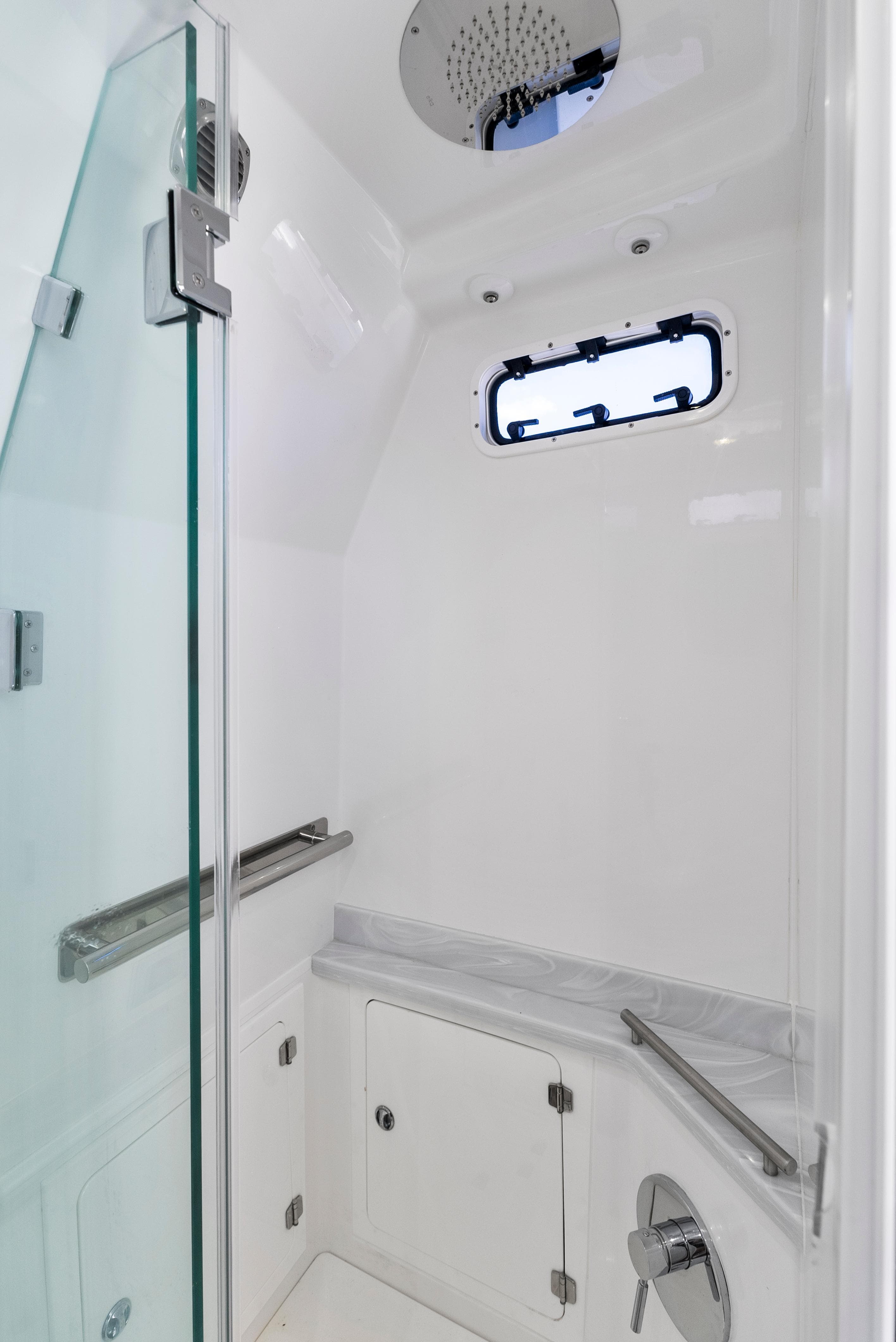 2022 HCB Suenos boat shower with glass door and modern fixtures.