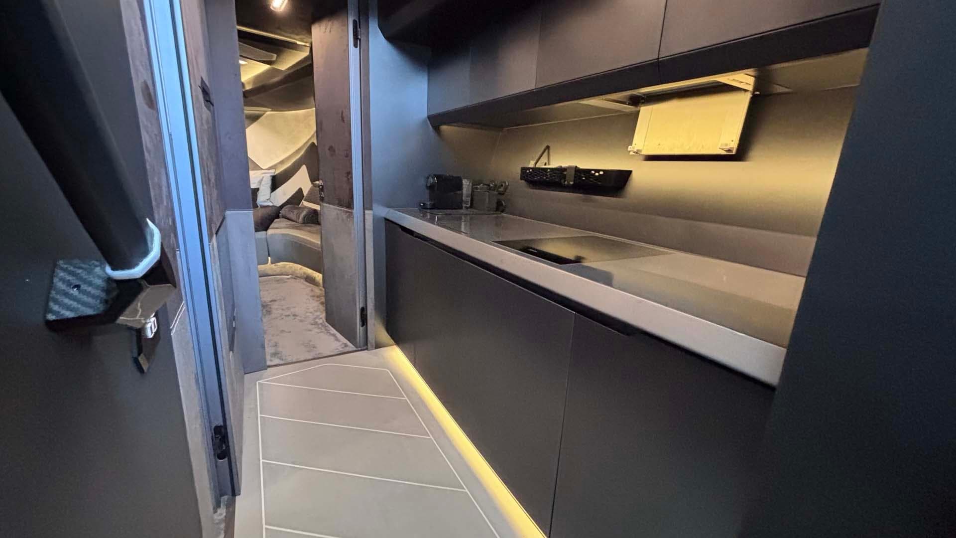 Luxurious interior of 2022 Tecnomar Lamborghini 63 yacht, featuring sleek modern kitchen design.