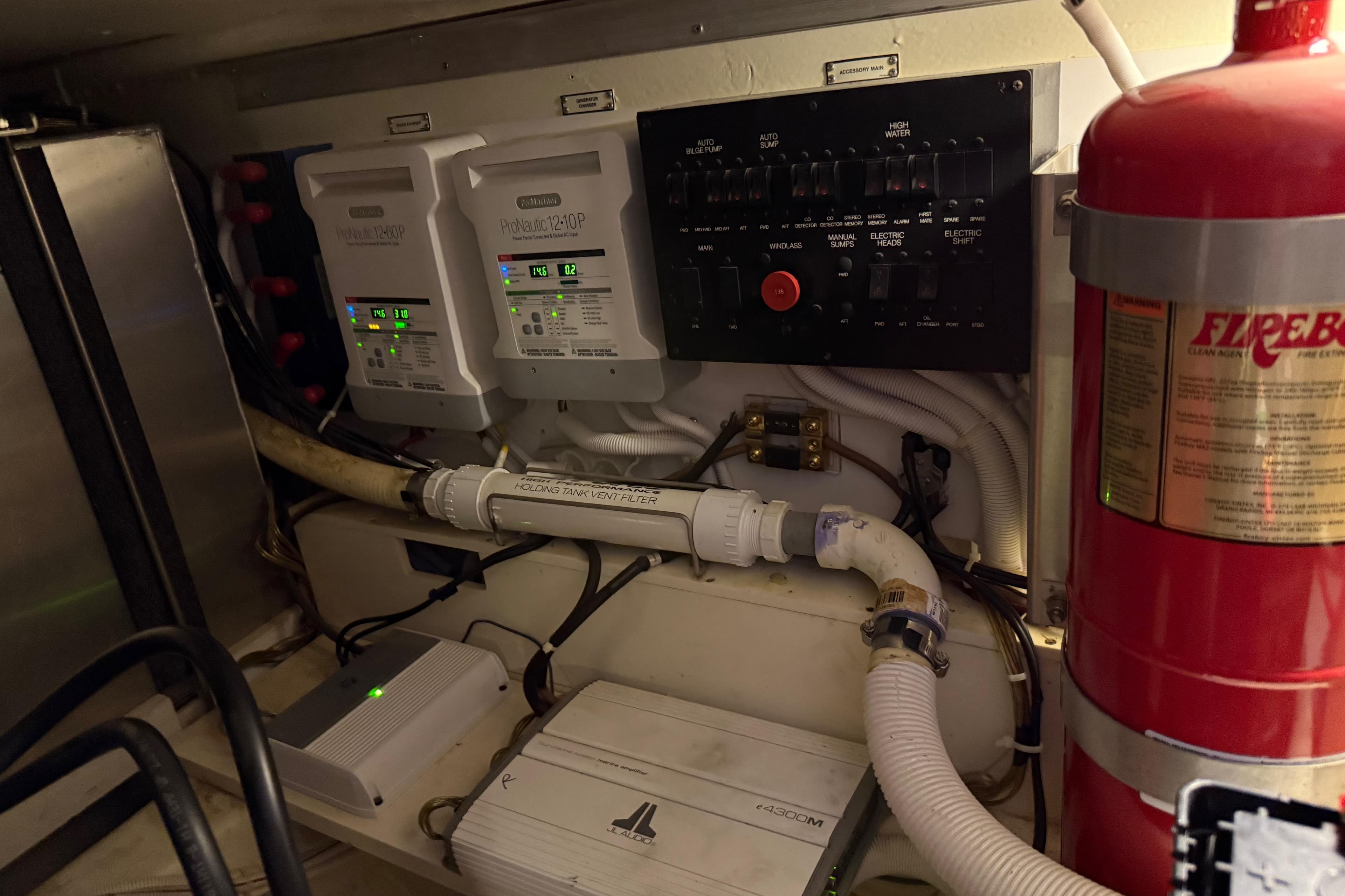 Electrical panel and fire extinguisher in 2004 Carver 360 Sport Sedan engine room.