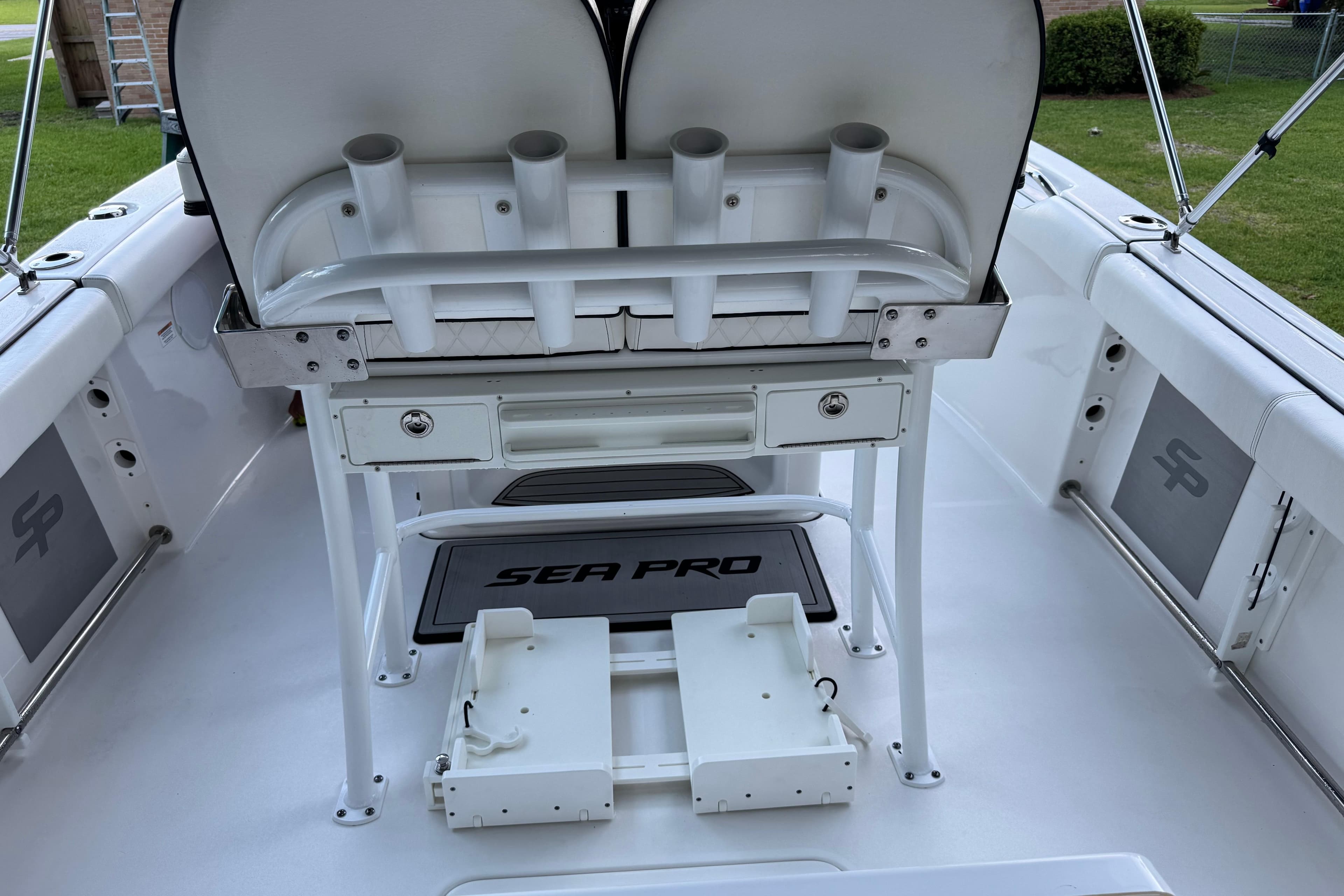2022 Sea Pro 219 Center Console boat interior with rod holders and storage compartments.