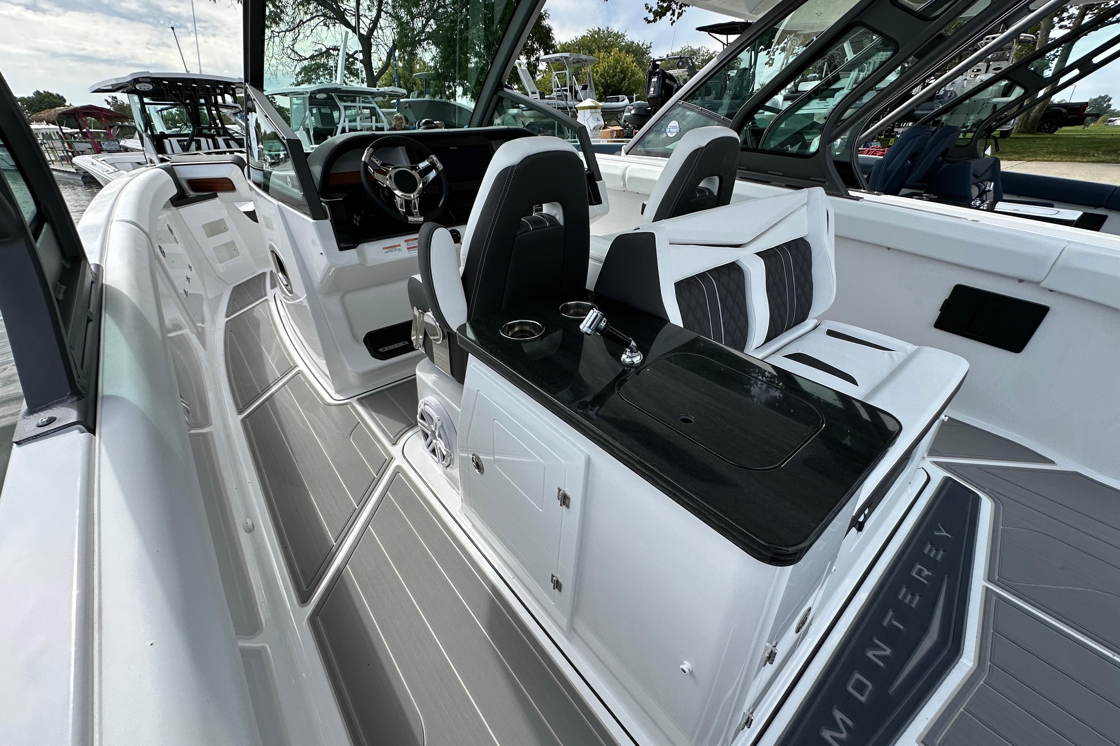 2026 Monterey Elite 30 OB boat interior with sleek seating and modern dashboard design.