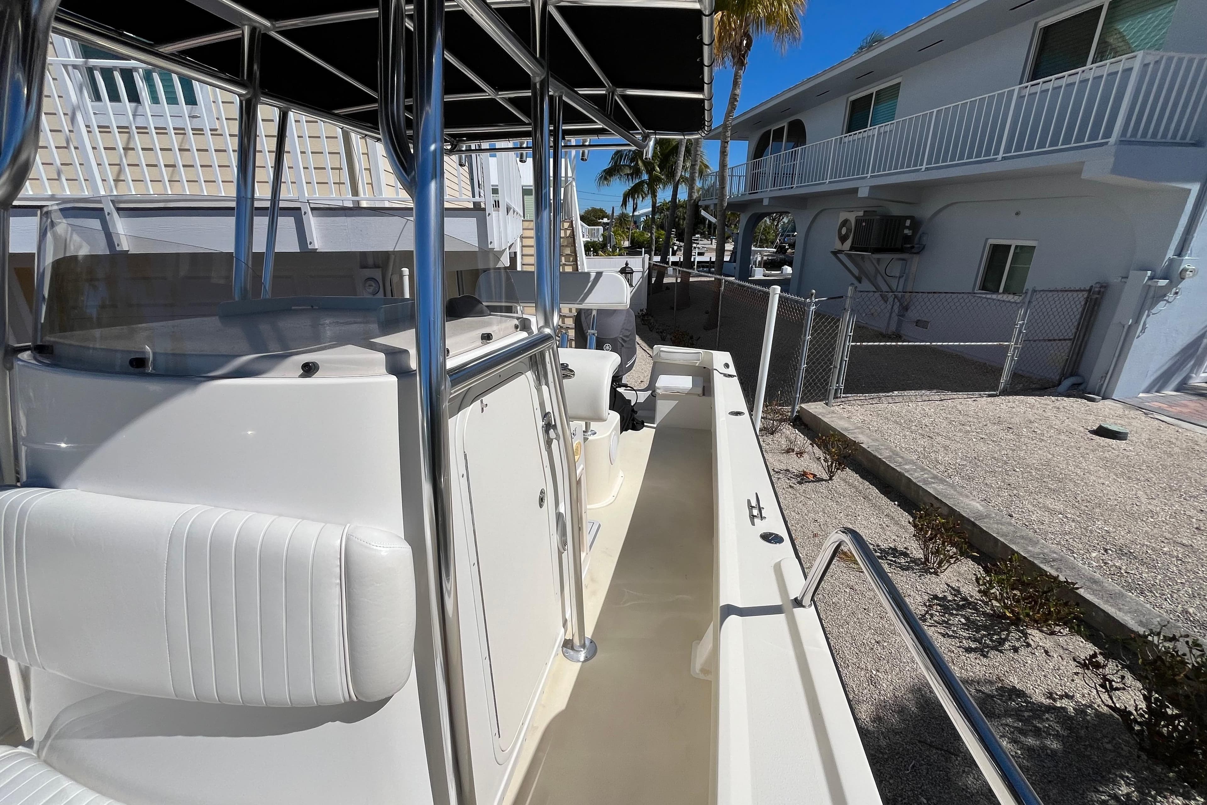 2009 Parker 2300 Special Edition boat docked near residential area.