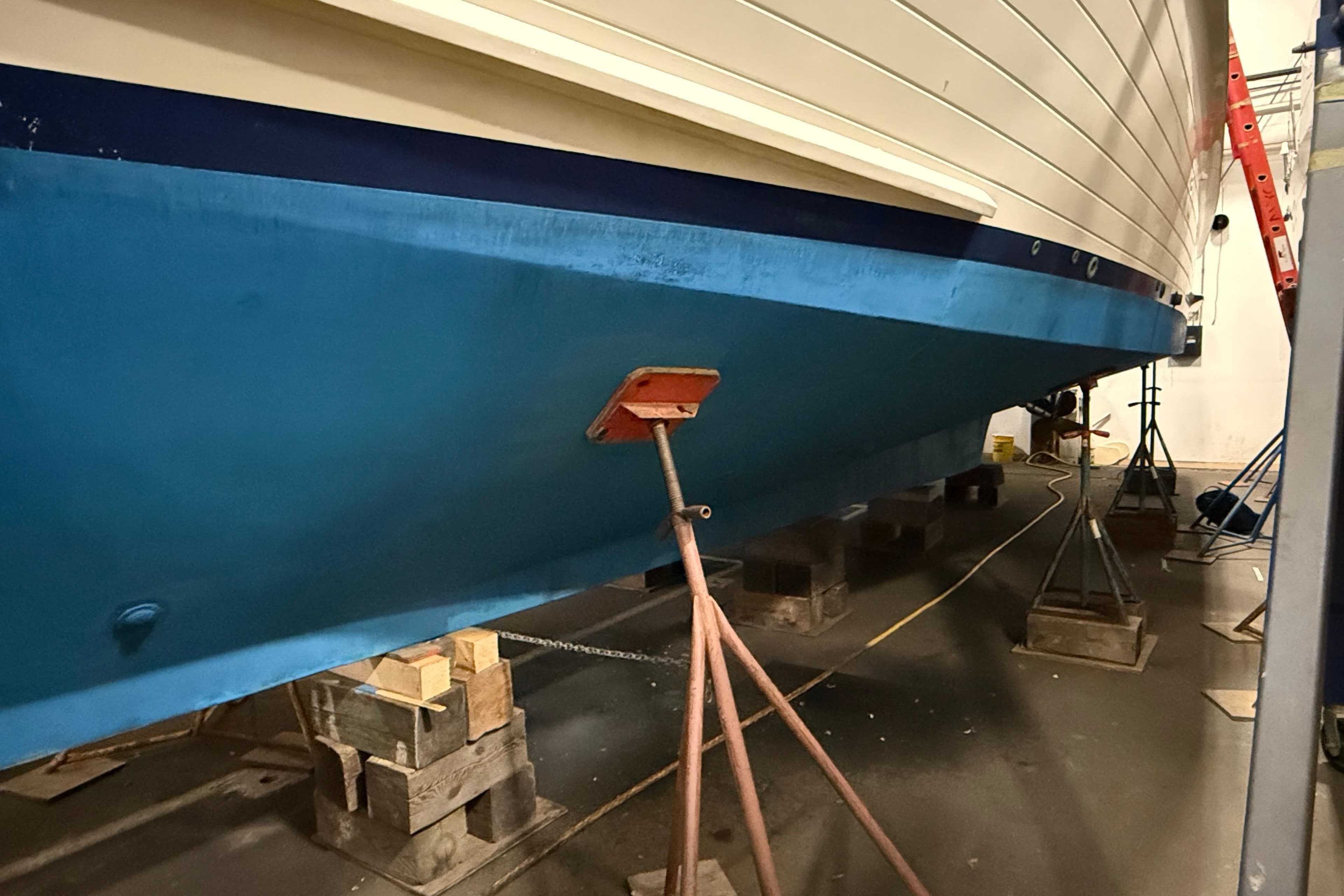 1991 Grand Banks 42 Classic yacht in dry dock, supported by stands and blocks.