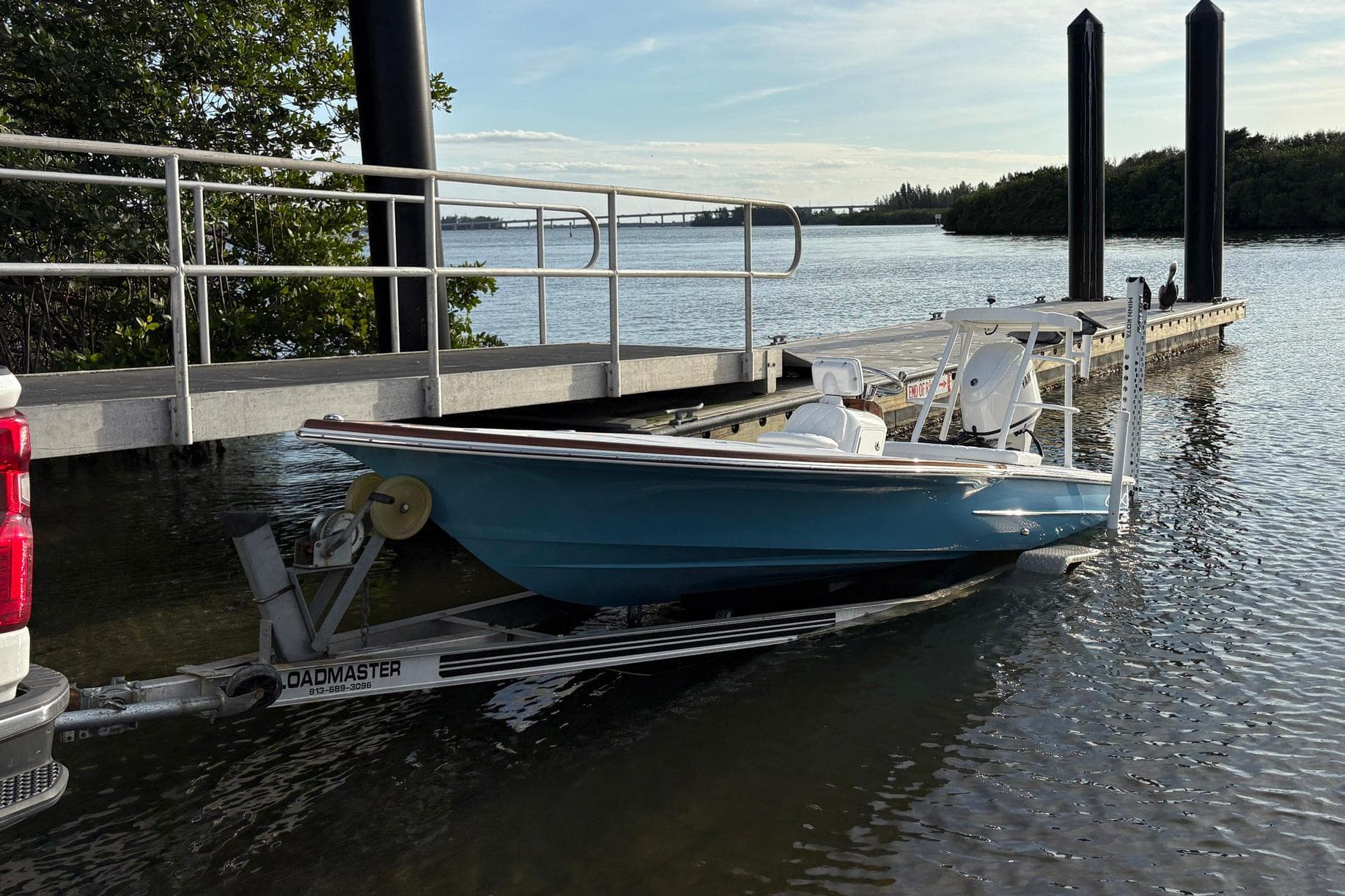 2026 Chaos 16 Bonefish boat on trailer at dockside, ready for launch.