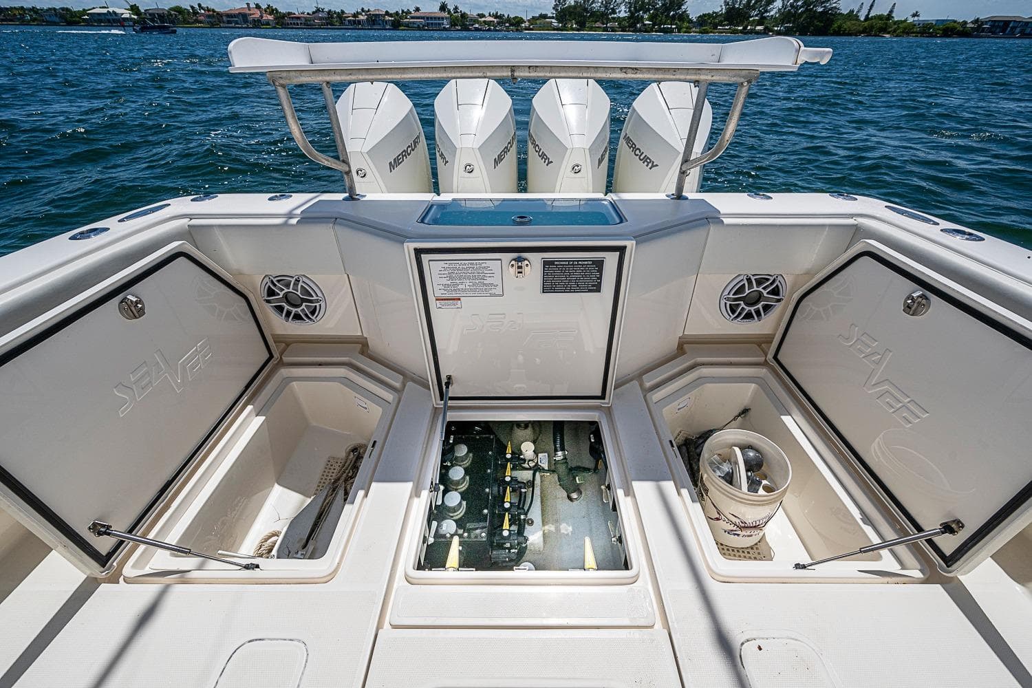 2023 SeaVee 390B boat deck with storage compartments and Mercury engines.