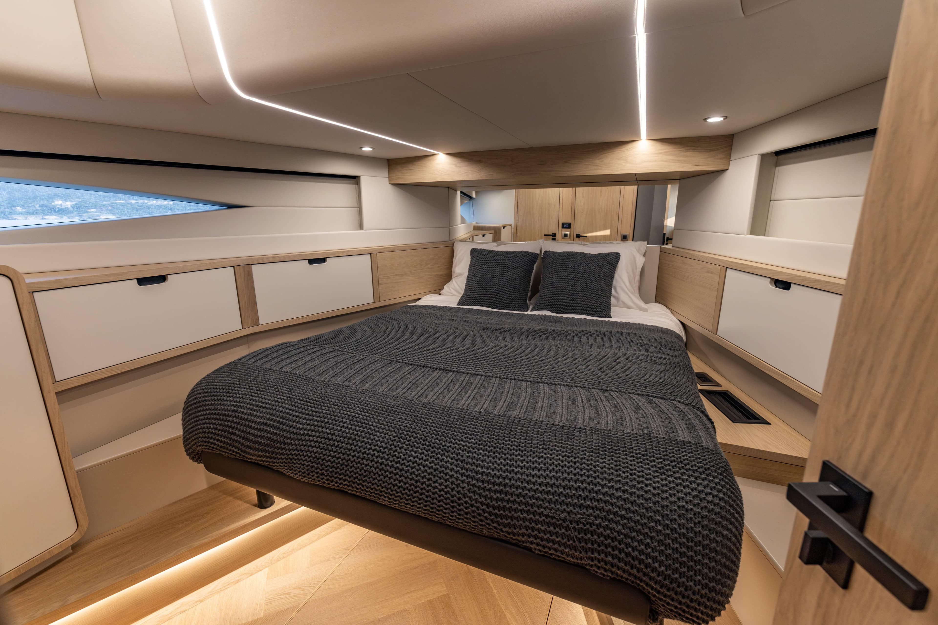 Luxurious bedroom interior of 2025 Steeler Bronson 65 yacht with modern design.