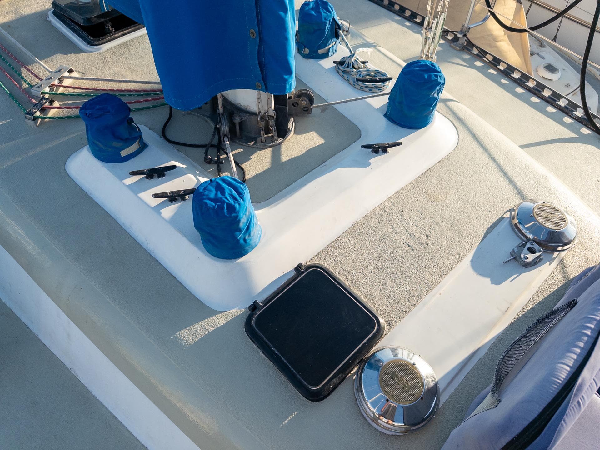 1979 Costa Custom Boats Sloop deck with blue covers and sailing equipment.