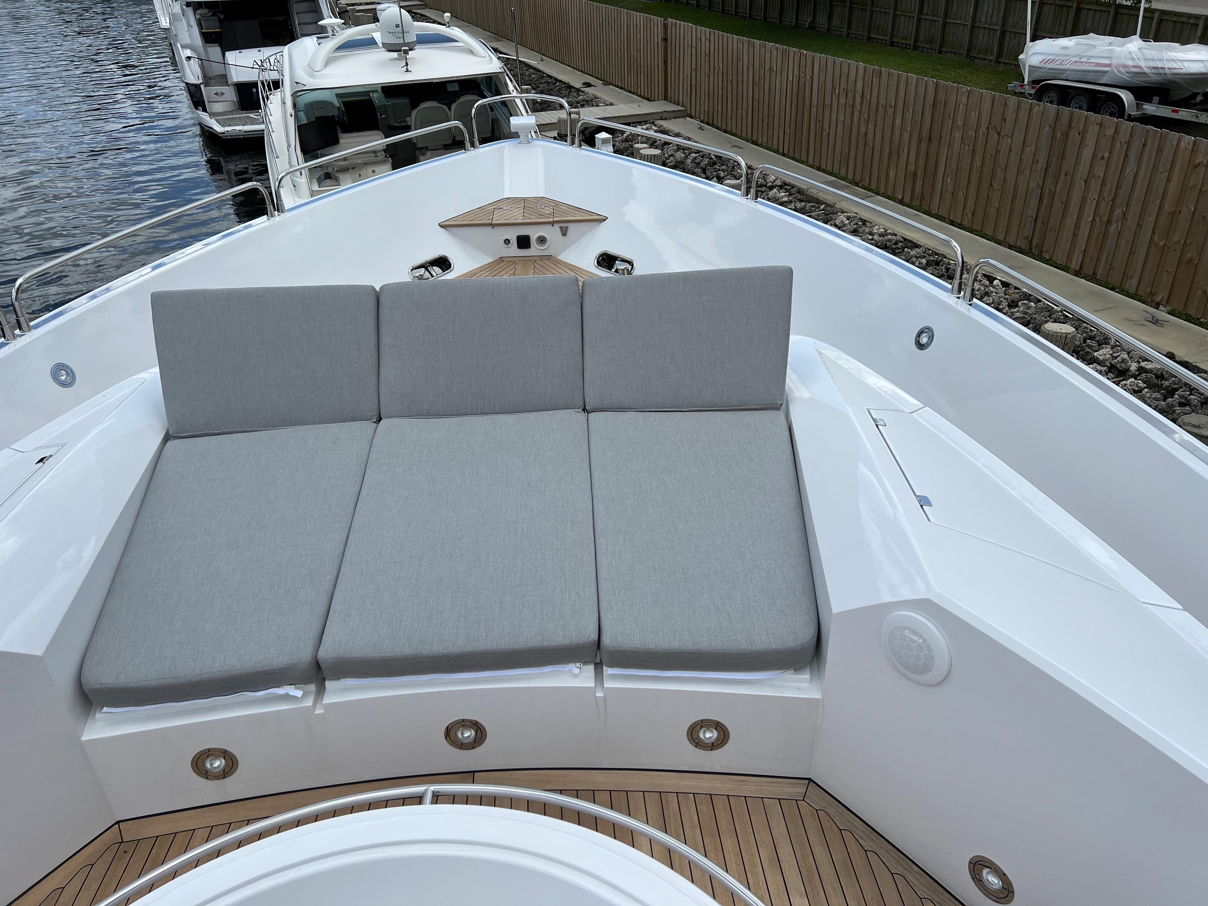 Sunseeker Predator 108 2007 yacht with cushioned sunbathing area on deck.