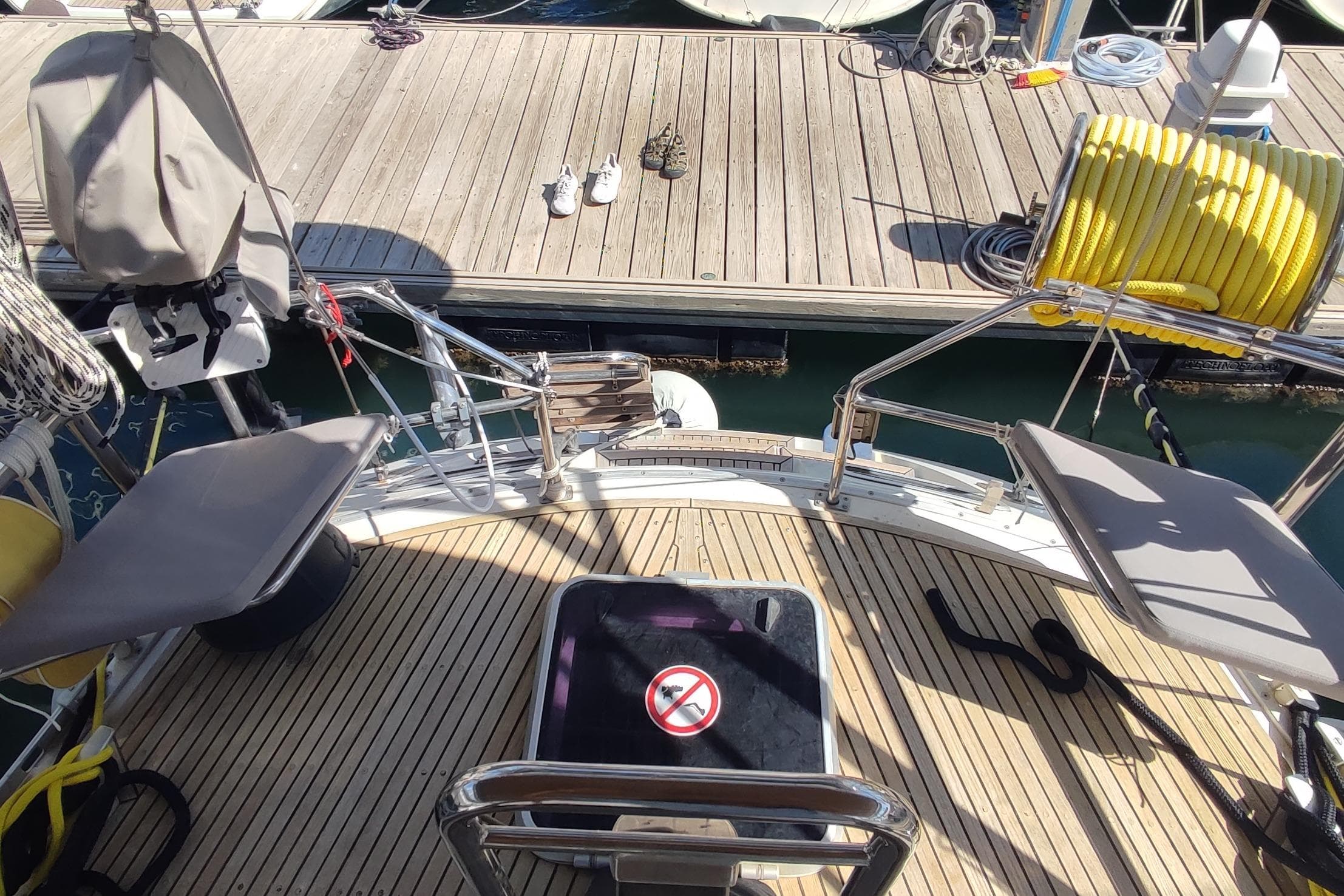 Deck view of a 1997 Nauticat 42 yacht docked at a marina.