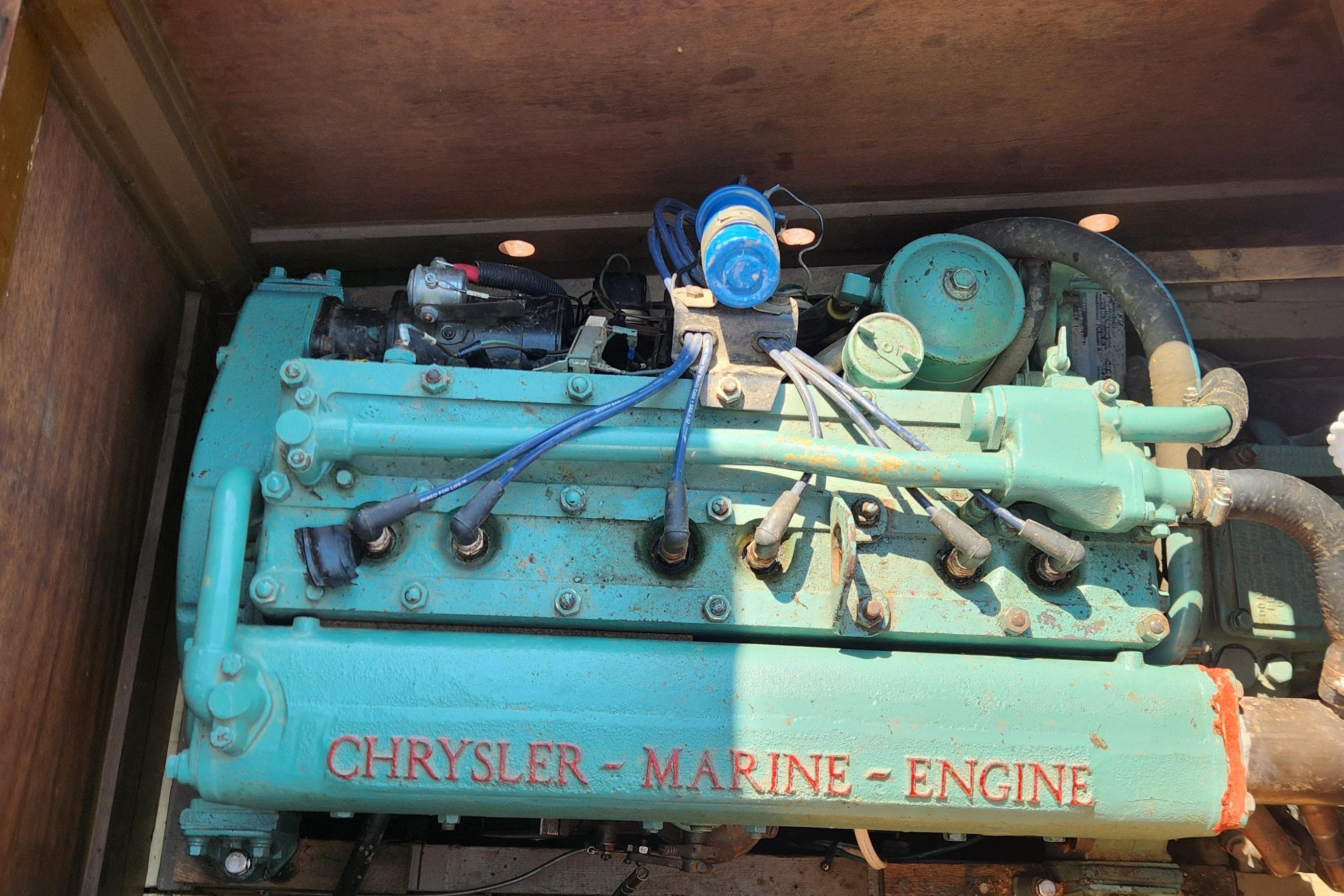 1958 Lyman Runabout with Chrysler marine engine, showcasing vintage craftsmanship.