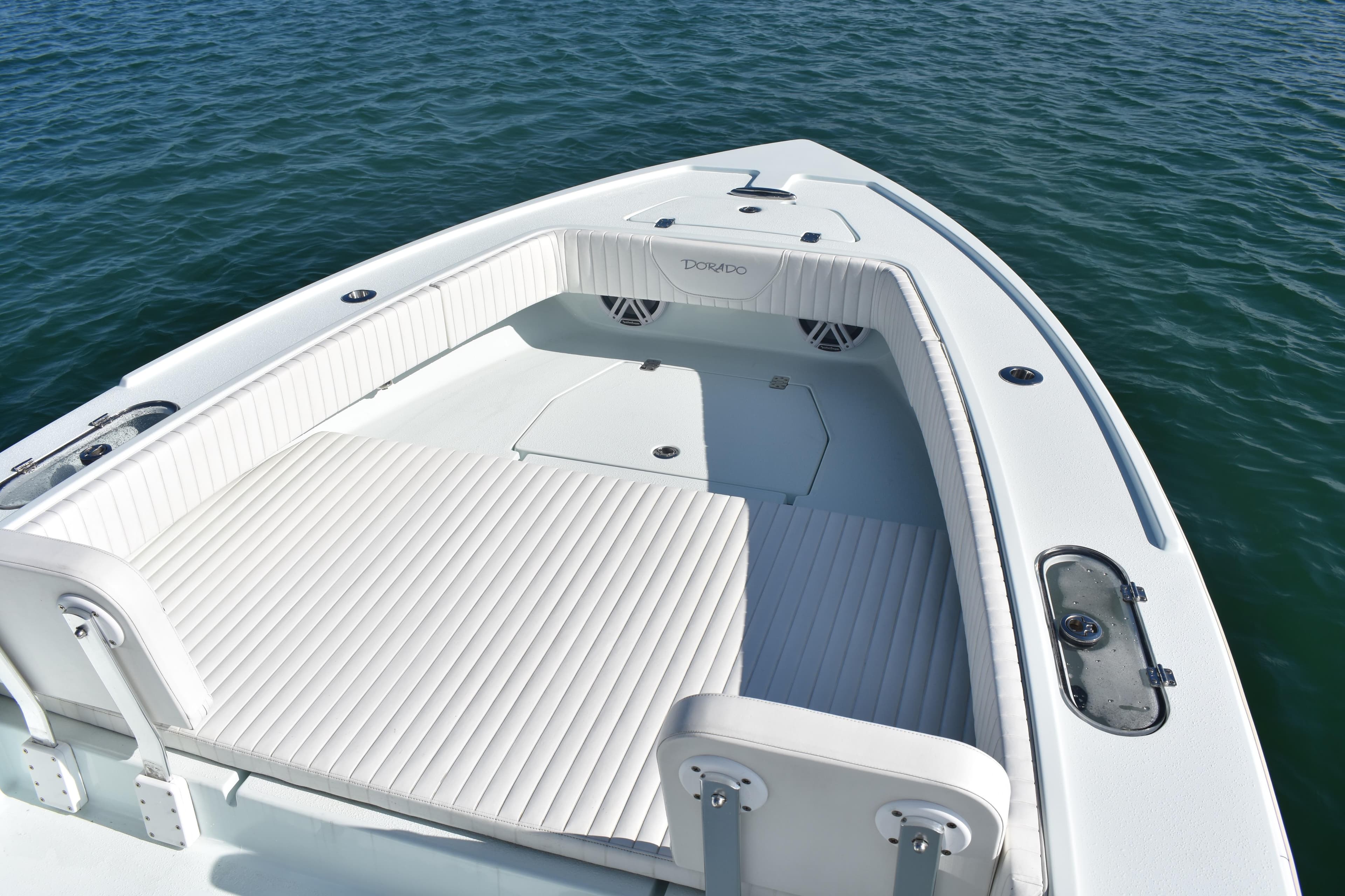 2023 Dorado 25 boat with spacious deck and seating on calm water.