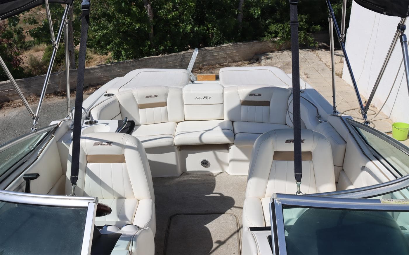 2007 Sea Ray 250 SLX boat interior with white seating and open deck layout.