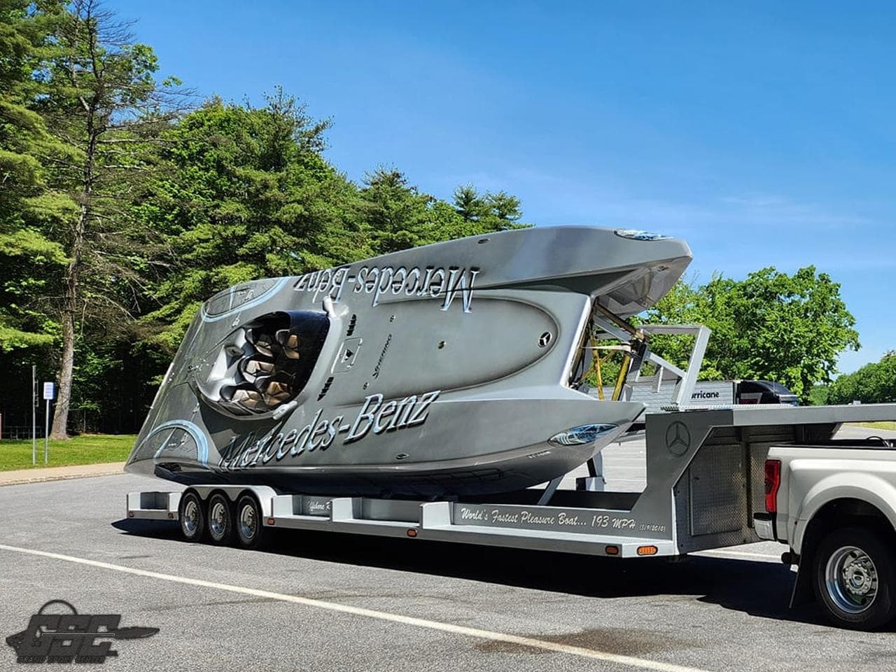 2007 MTI 44 AMG TRIBUTE powerboat on a trailer, parked outdoors.